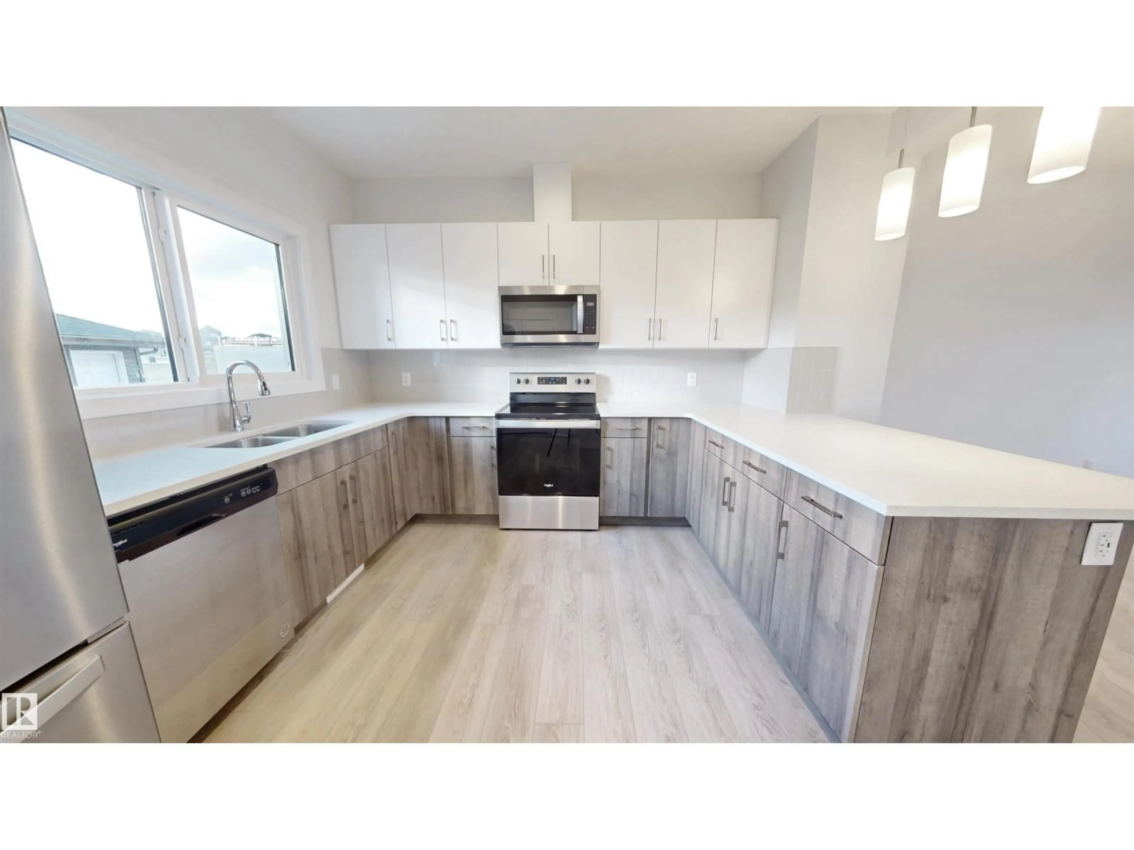Open concept kitchen, wood/laminate floor for 691 CAMBRIAN BV, Sherwood Park Alberta T8H3B7