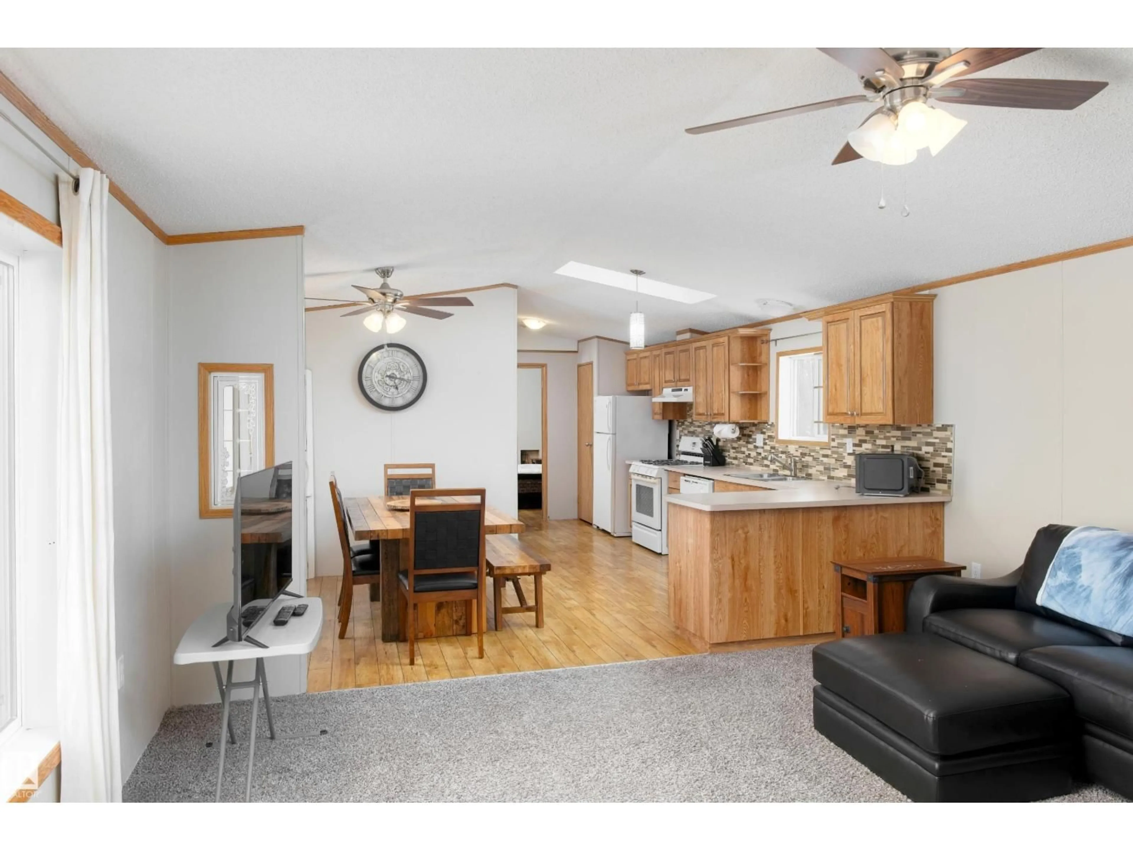 Open concept kitchen, wood/laminate floor for 59317 RGE RD 51, Rural Barrhead County Alberta T7N1N3