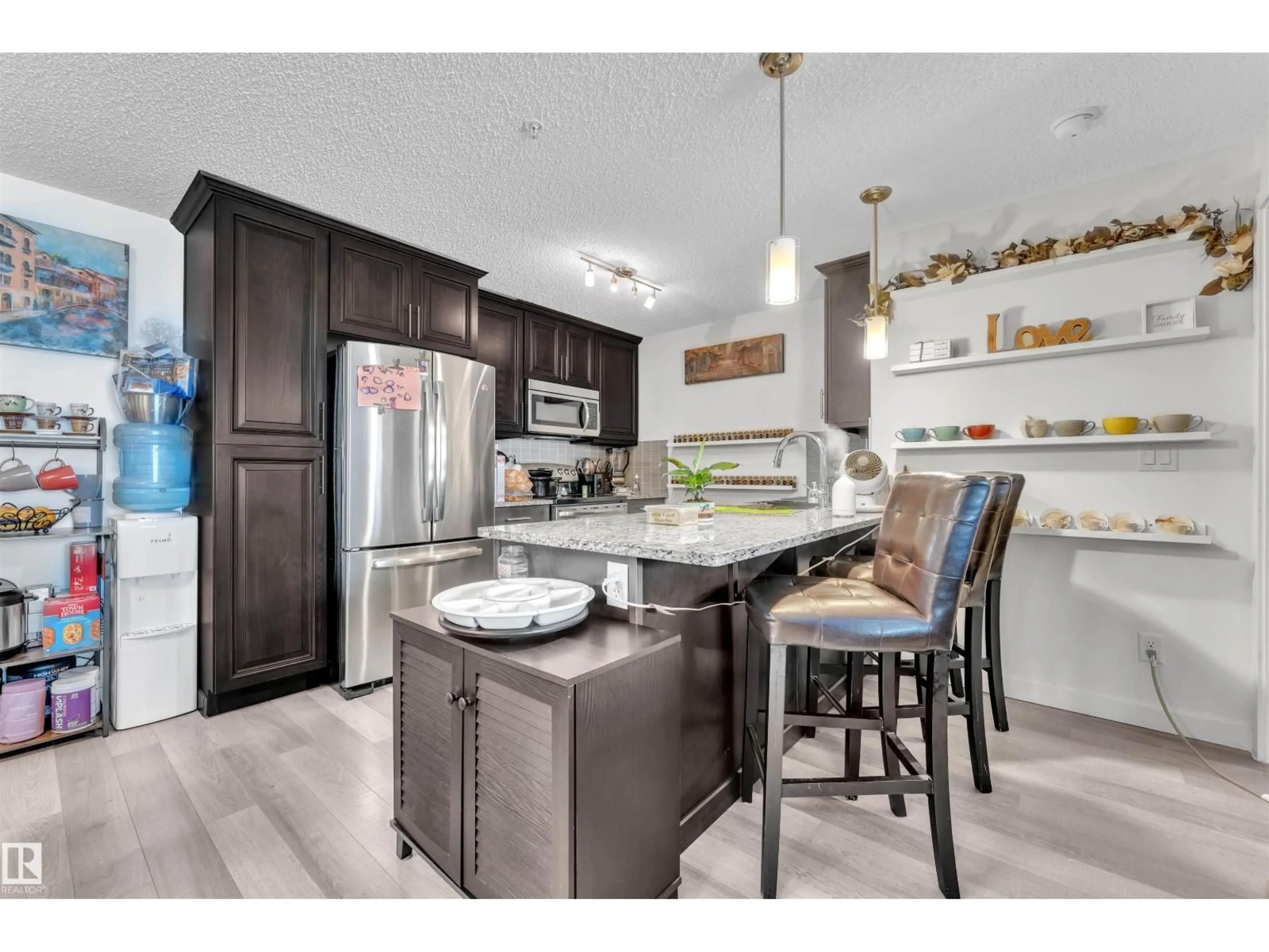 Open concept kitchen, unknown for 228 - 6076 SCHONSEE WY, Edmonton Alberta T5Z0K8