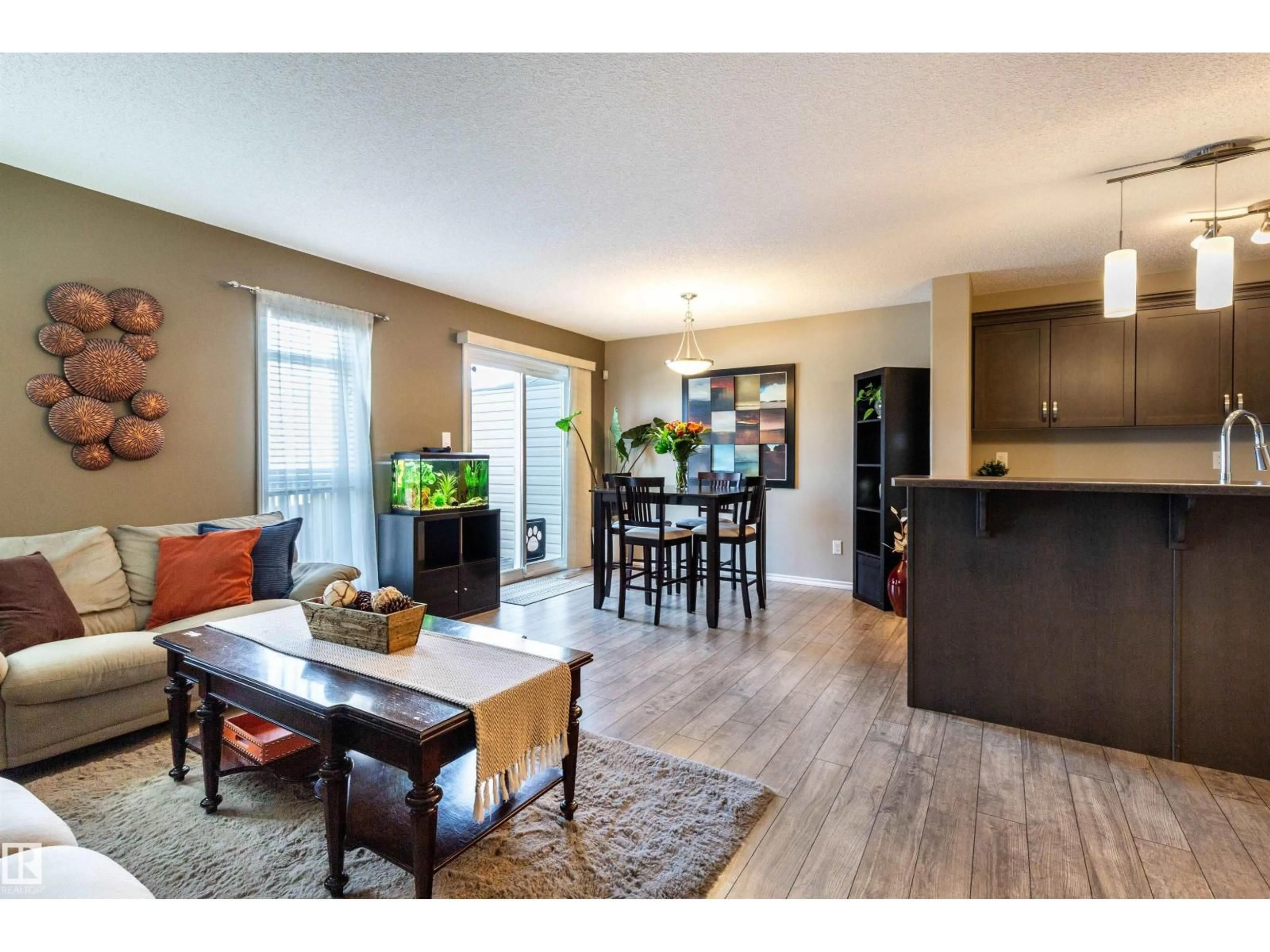 Open concept kitchen, wood/laminate floor for 112 KIRPATRICK WY, Leduc Alberta T9E0Z2