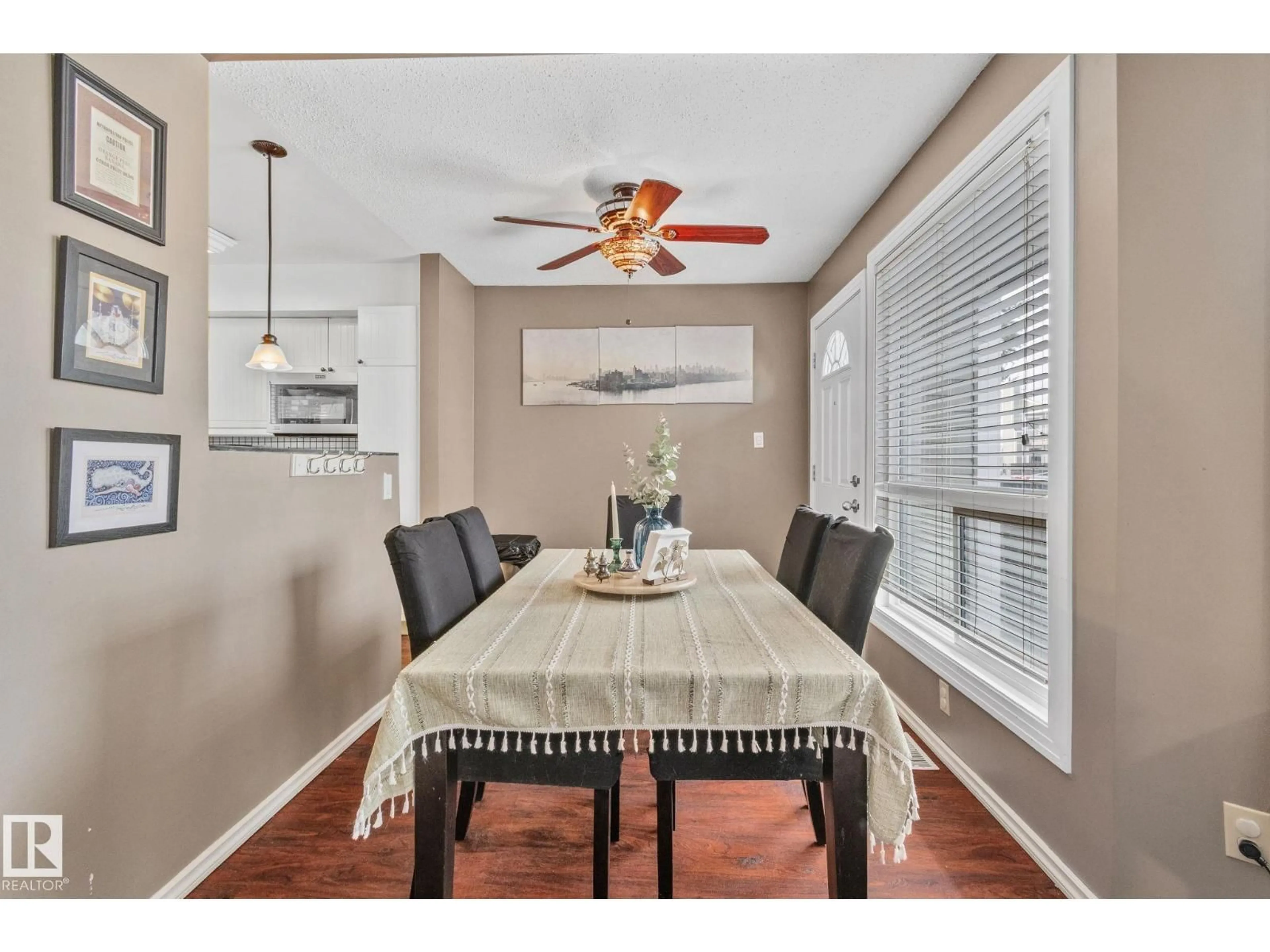 Dining room, wood/laminate floor for #3 - 1820 56 ST, Edmonton Alberta T6L5L4