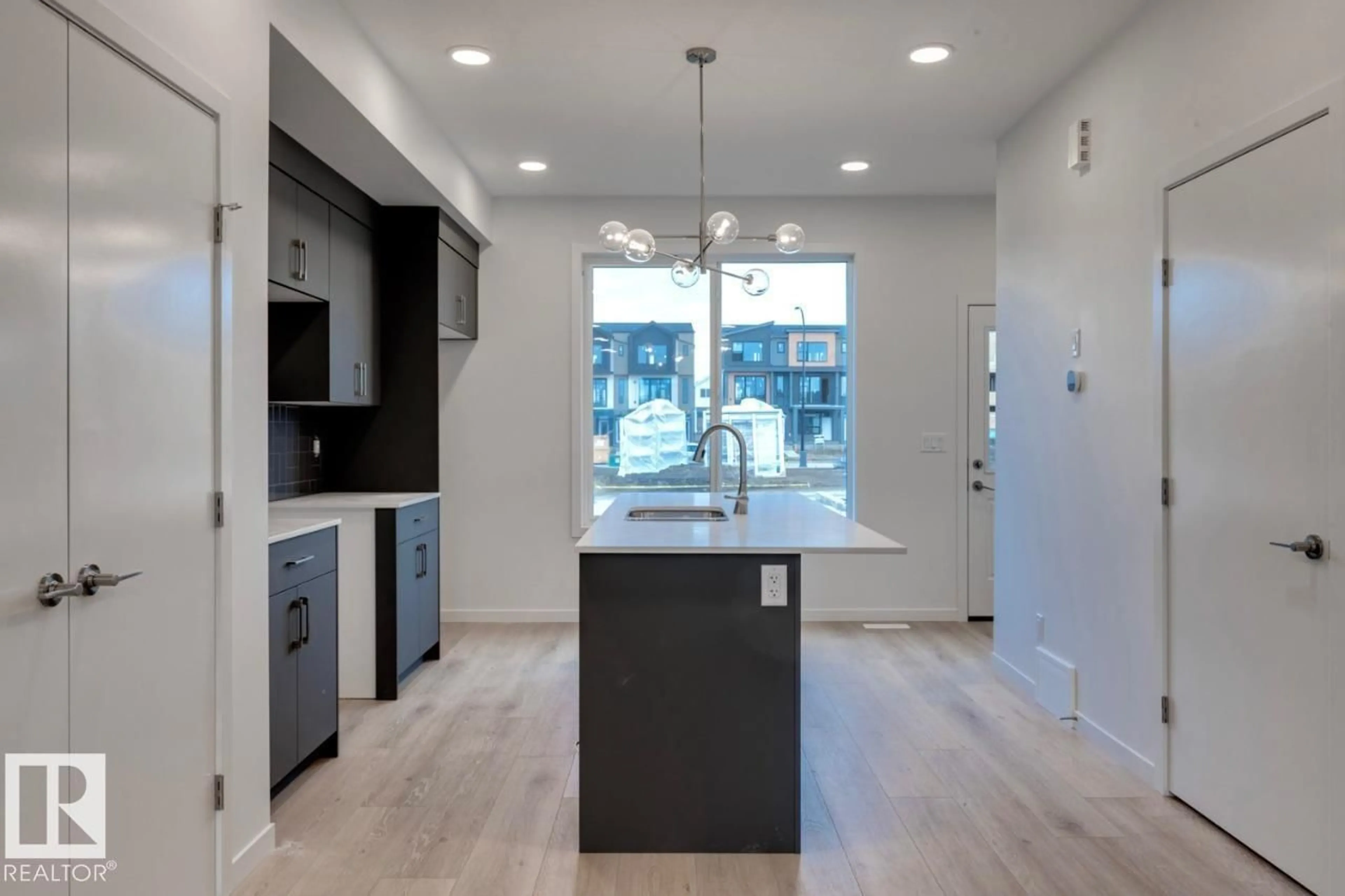 Open concept kitchen, unknown for LI SW - 7528 KLAPSTEIN LINK, Edmonton Alberta T6W5S7