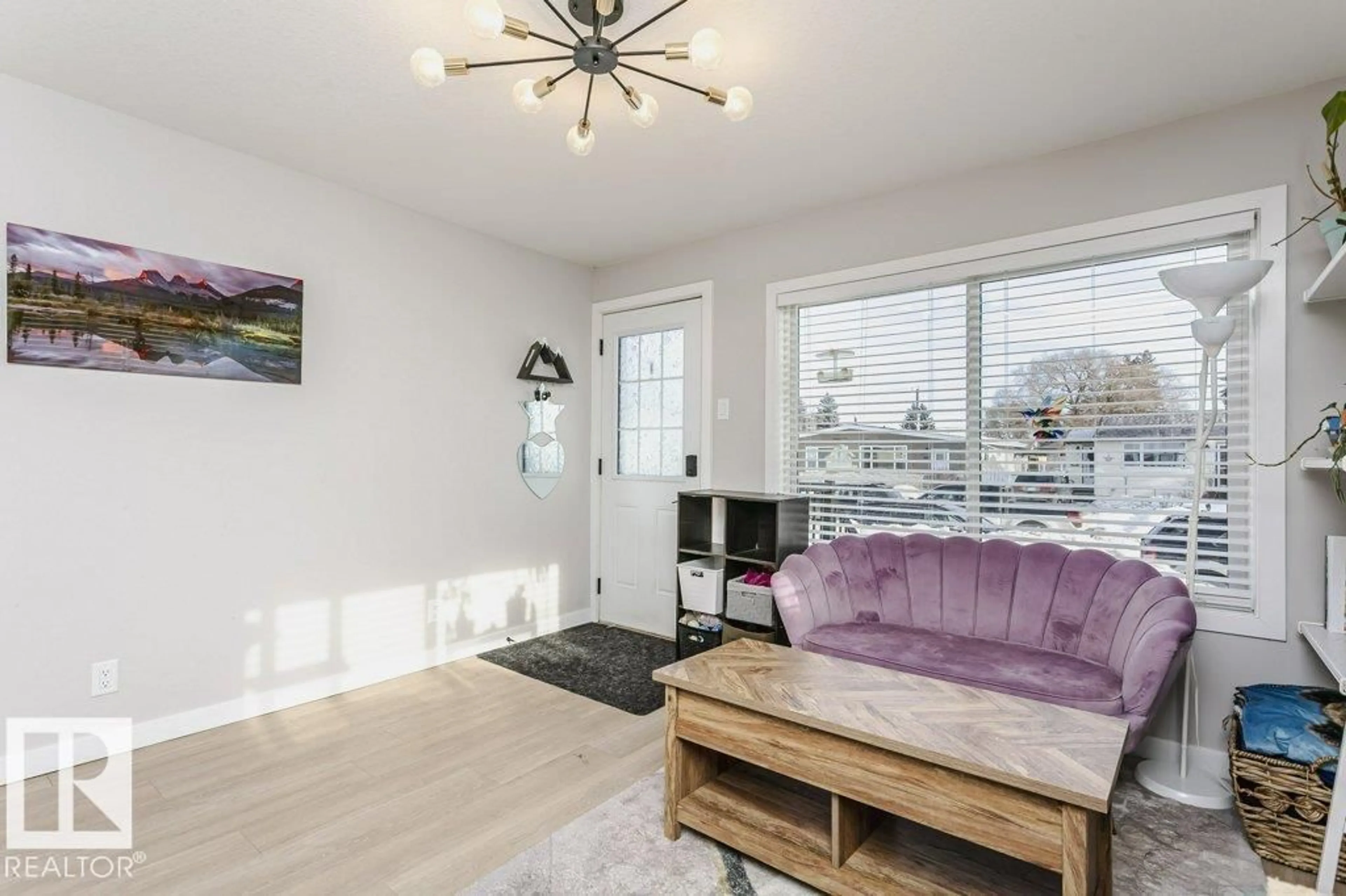 Living room with furniture, wood/laminate floor for NW - 9020 152 ST, Edmonton Alberta T5R1M3