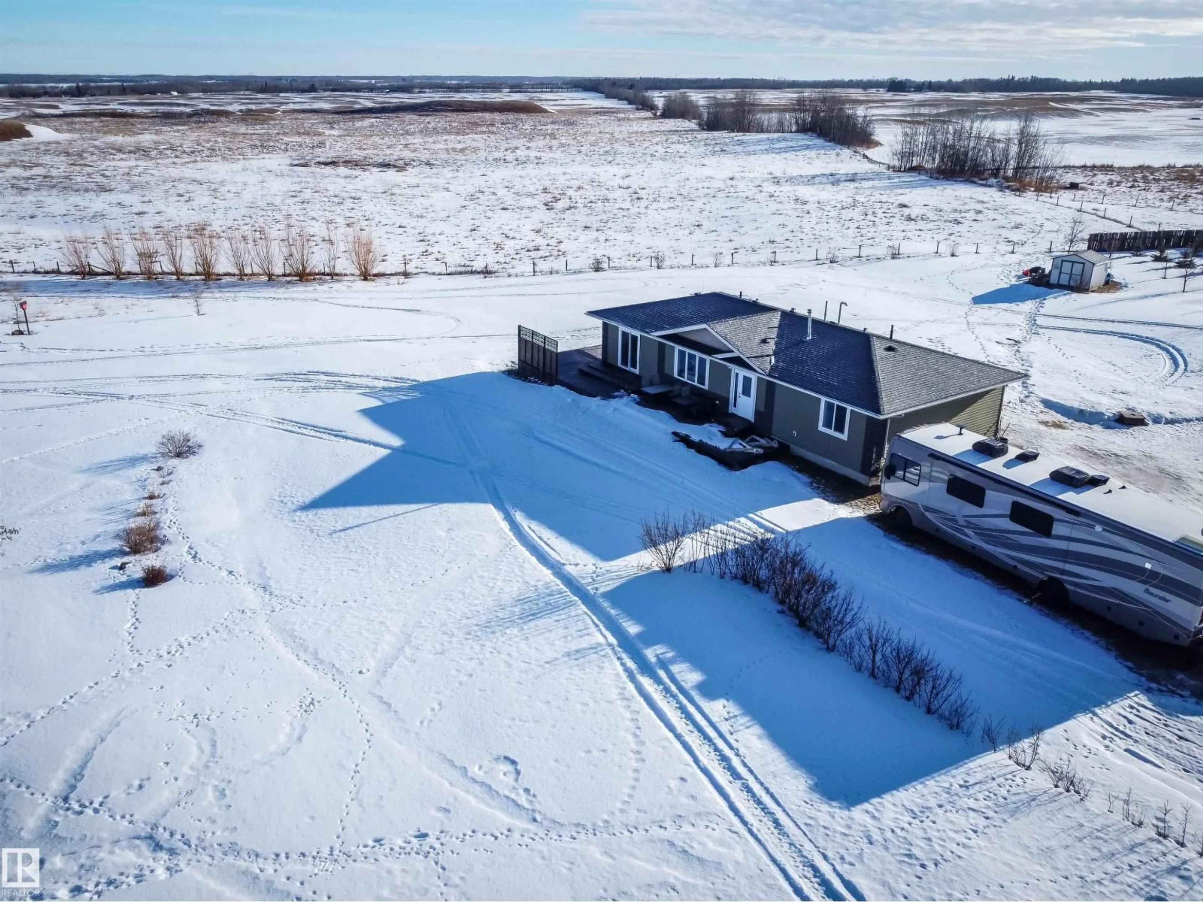 A pic from outside/outdoor area/front of a property/back of a property/a pic from drone, water/lake/river/ocean view for 54101 RGE ROAD 35, Rural Lac Ste. Anne County Alberta T0E0A0