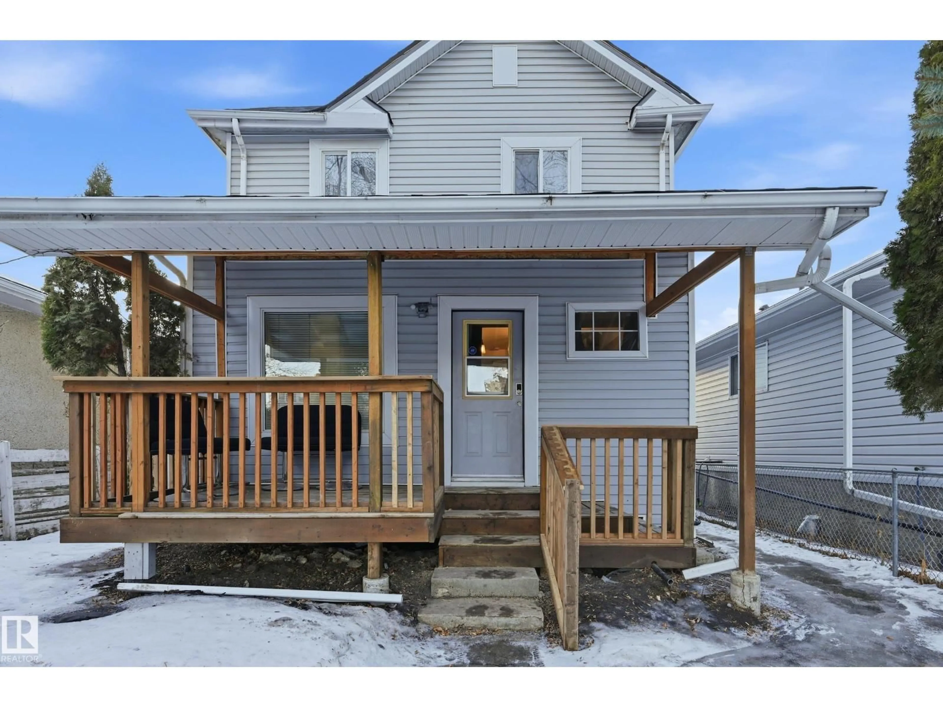 Home with vinyl exterior material, street for 10656 93 ST, Edmonton Alberta T5H1X9