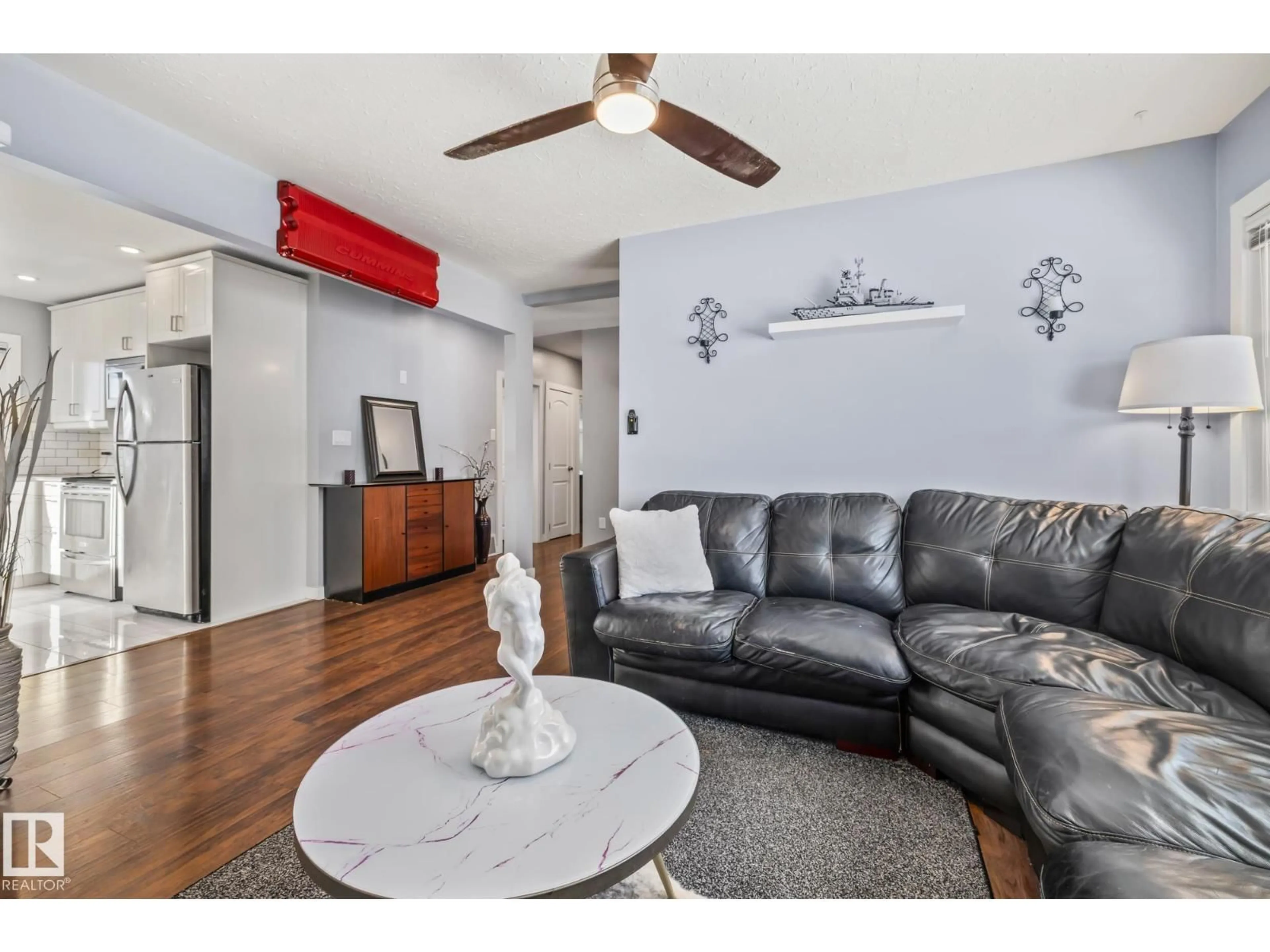 Living room with furniture, wood/laminate floor for 13608 137 ST, Edmonton Alberta T5L2B3