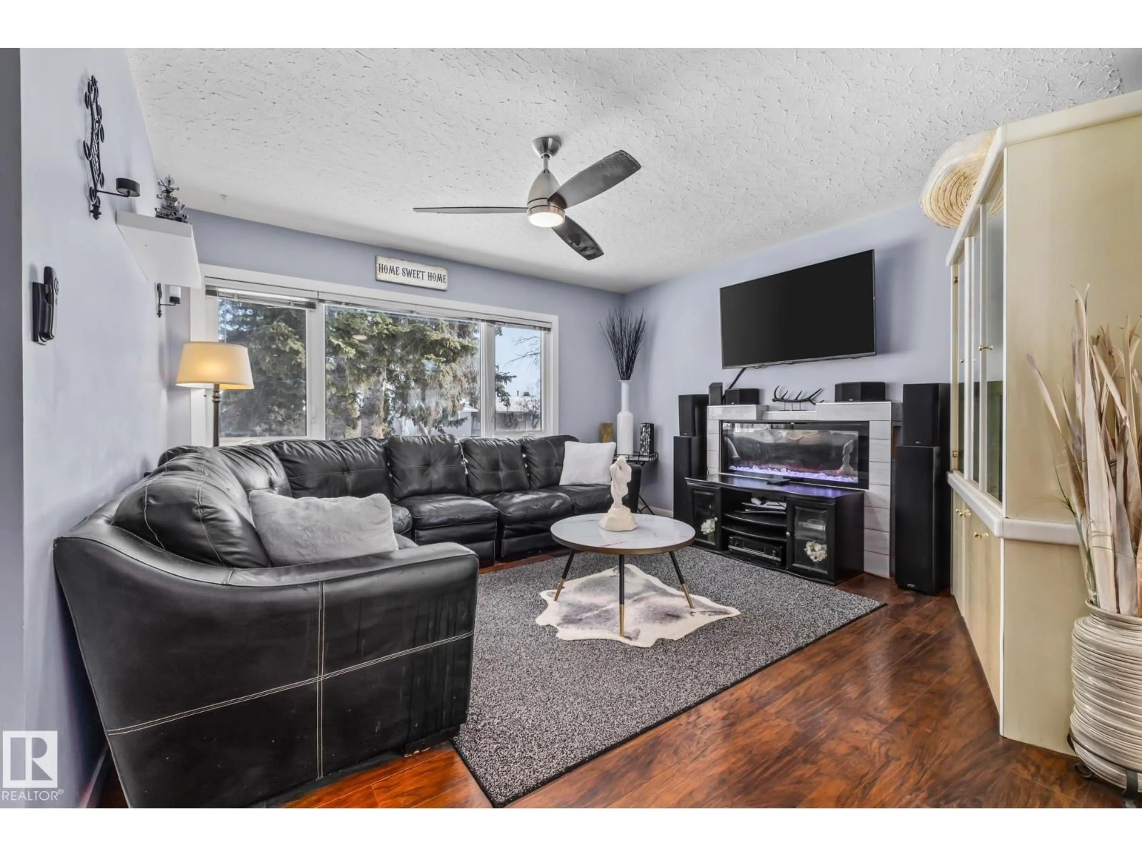 Living room with furniture, wood/laminate floor for 13608 137 ST, Edmonton Alberta T5L2B3