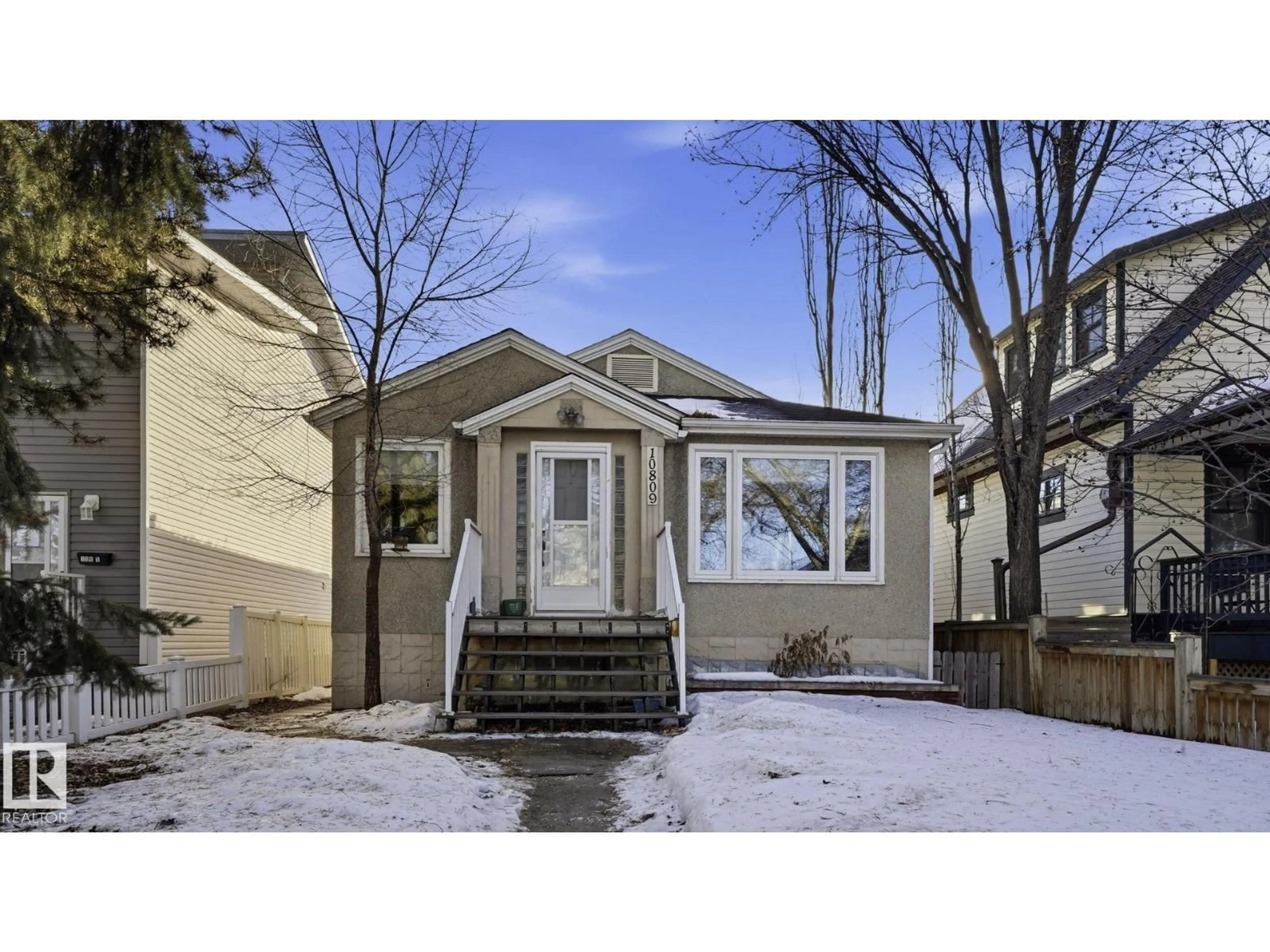 Home with vinyl exterior material, street for 10809 74 AV, Edmonton Alberta T6E1G8