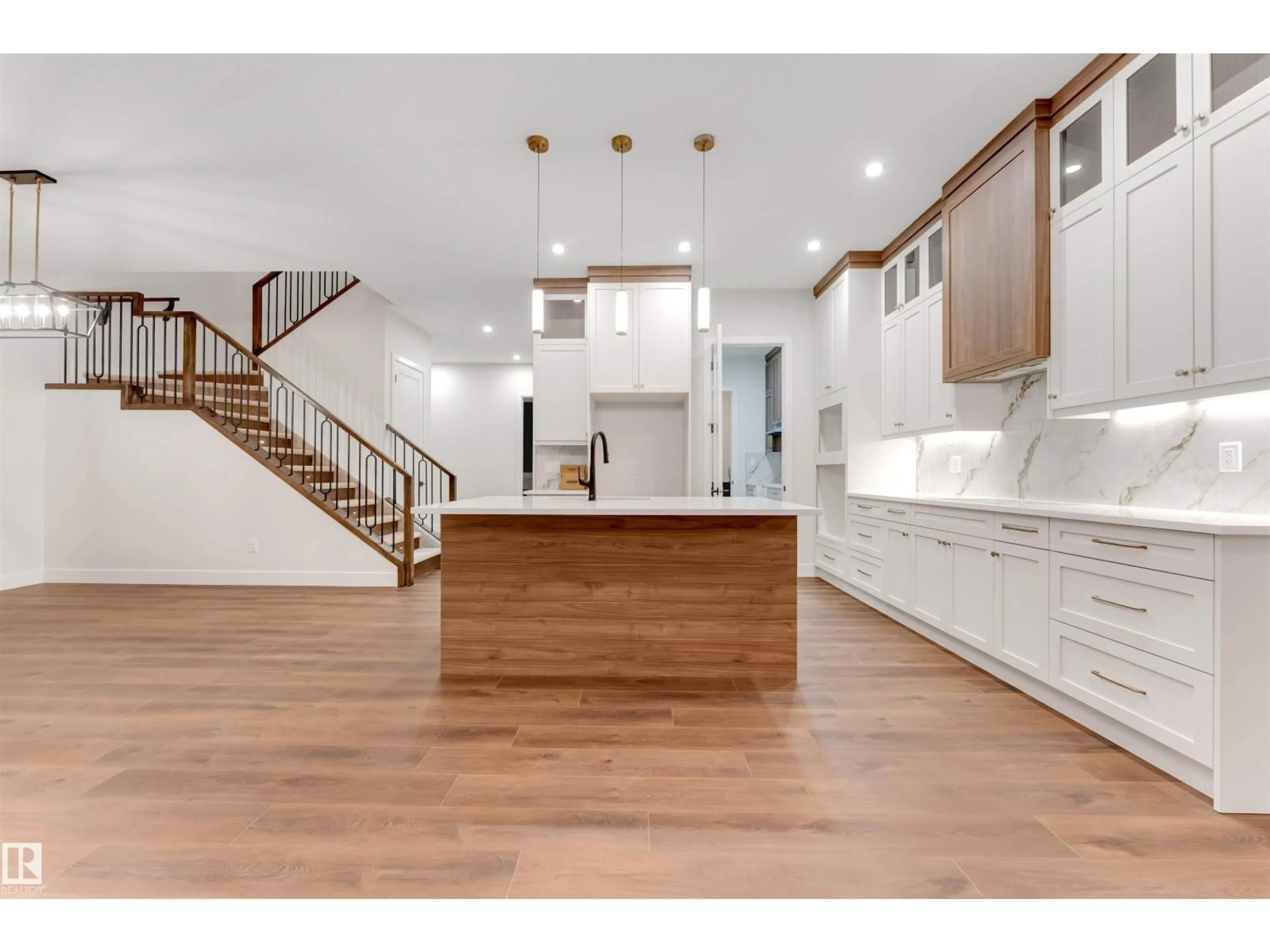 Open concept kitchen, wood/laminate floor for SW - 7663 KIMIWAN CR, Edmonton Alberta T6W5N6