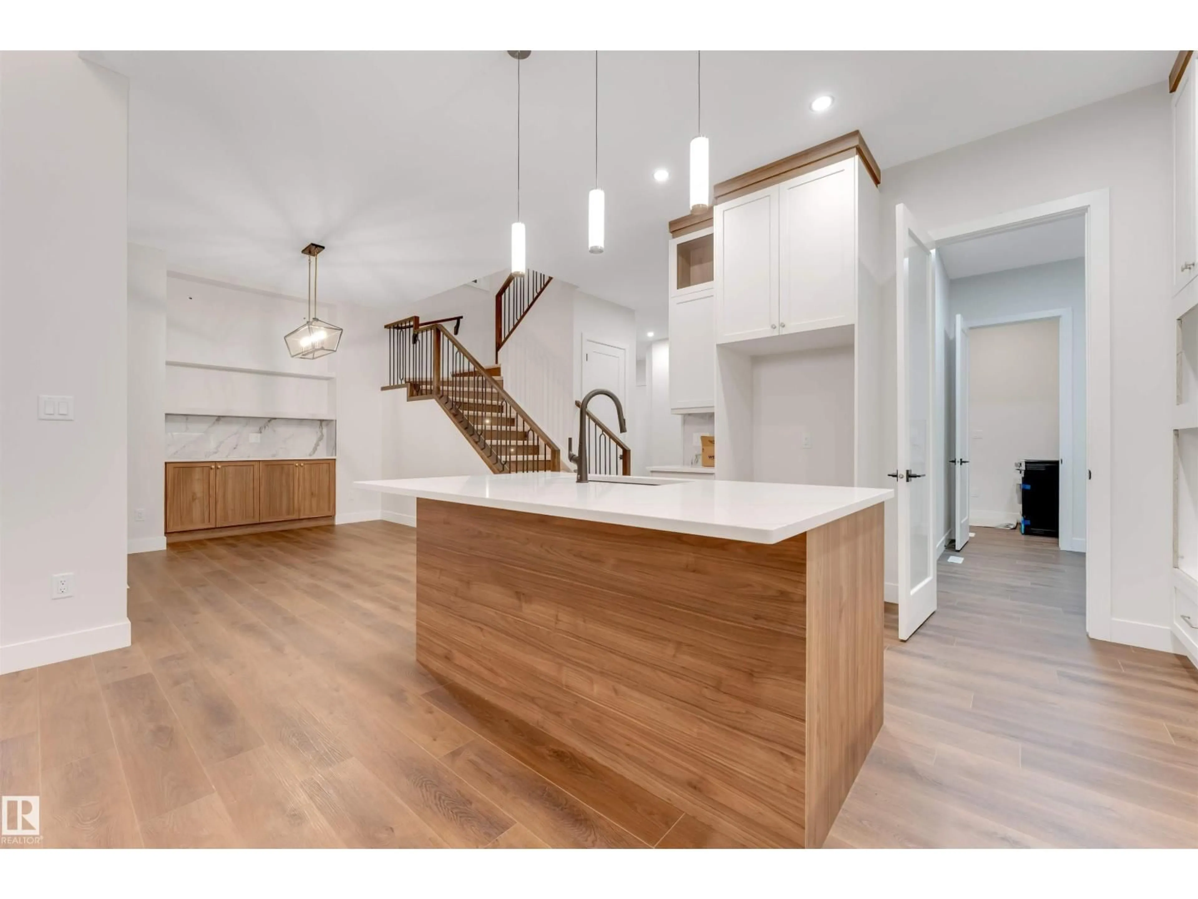 Open concept kitchen, wood/laminate floor for SW - 7663 KIMIWAN CR, Edmonton Alberta T6W5N6