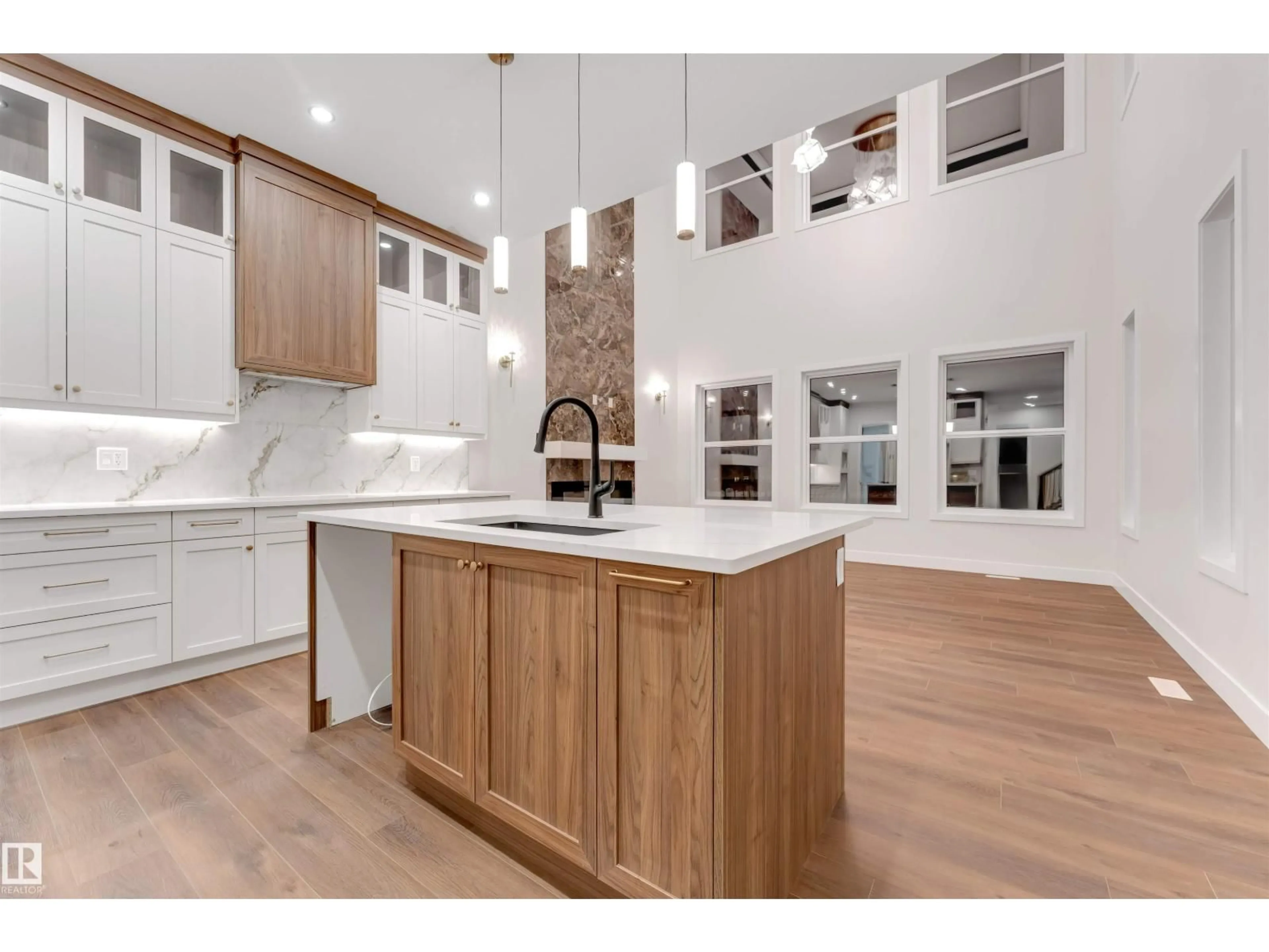 Open concept kitchen, wood/laminate floor for SW - 7663 KIMIWAN CR, Edmonton Alberta T6W5N6