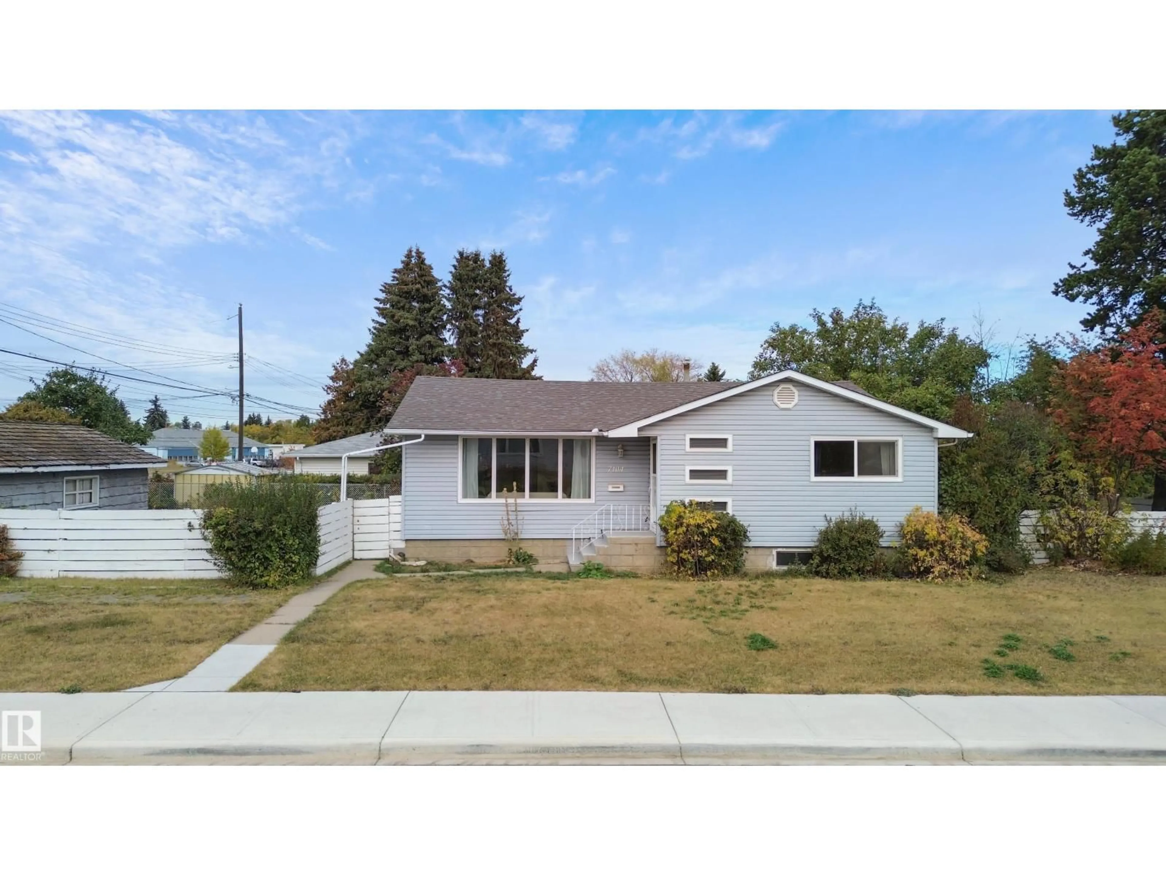 Home with vinyl exterior material, street for 7104 95 AV, Edmonton Alberta T6B1B2