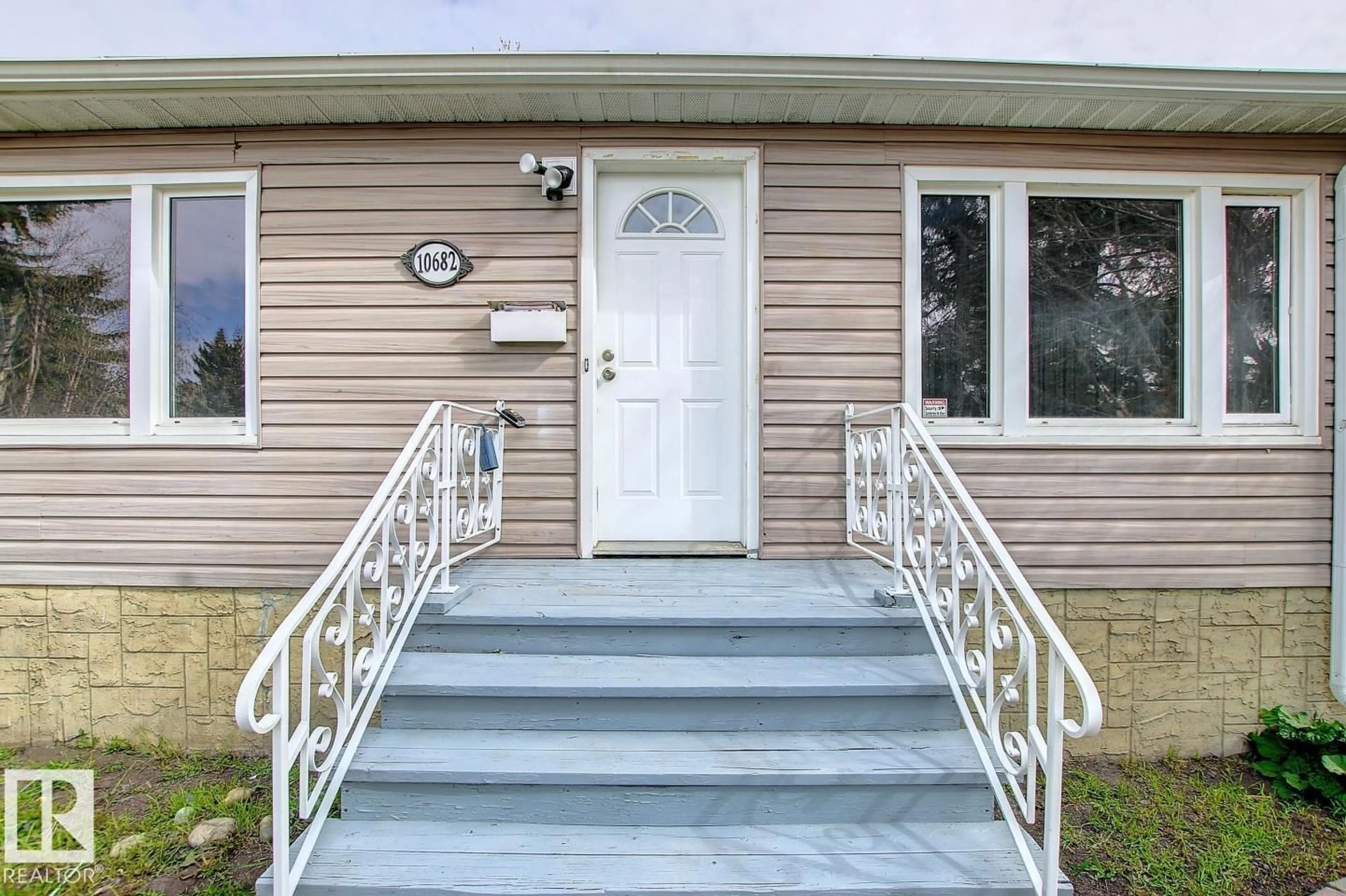 Home with vinyl exterior material, street for 10682 61 AV, Edmonton Alberta T6H1L7