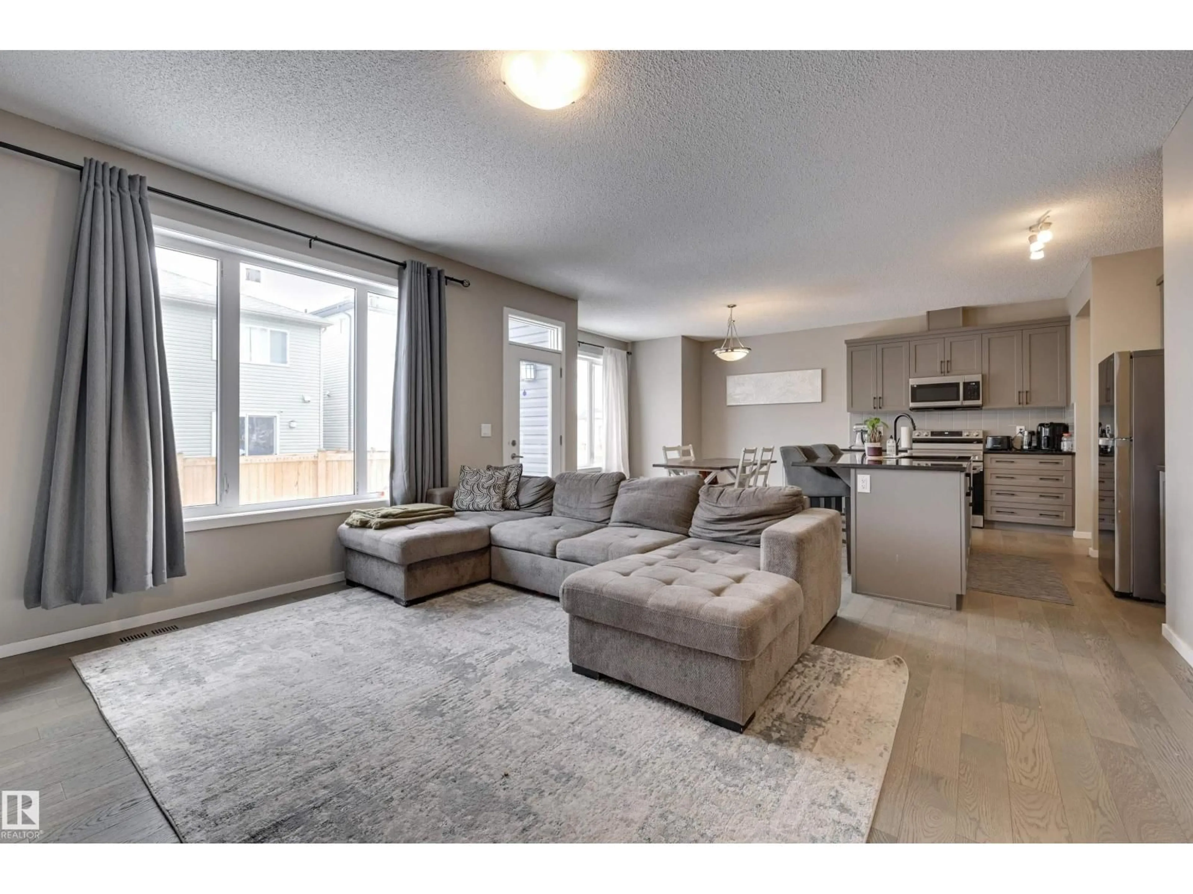 Living room with furniture, unknown for 2031 207 ST, Edmonton Alberta T6M1R7