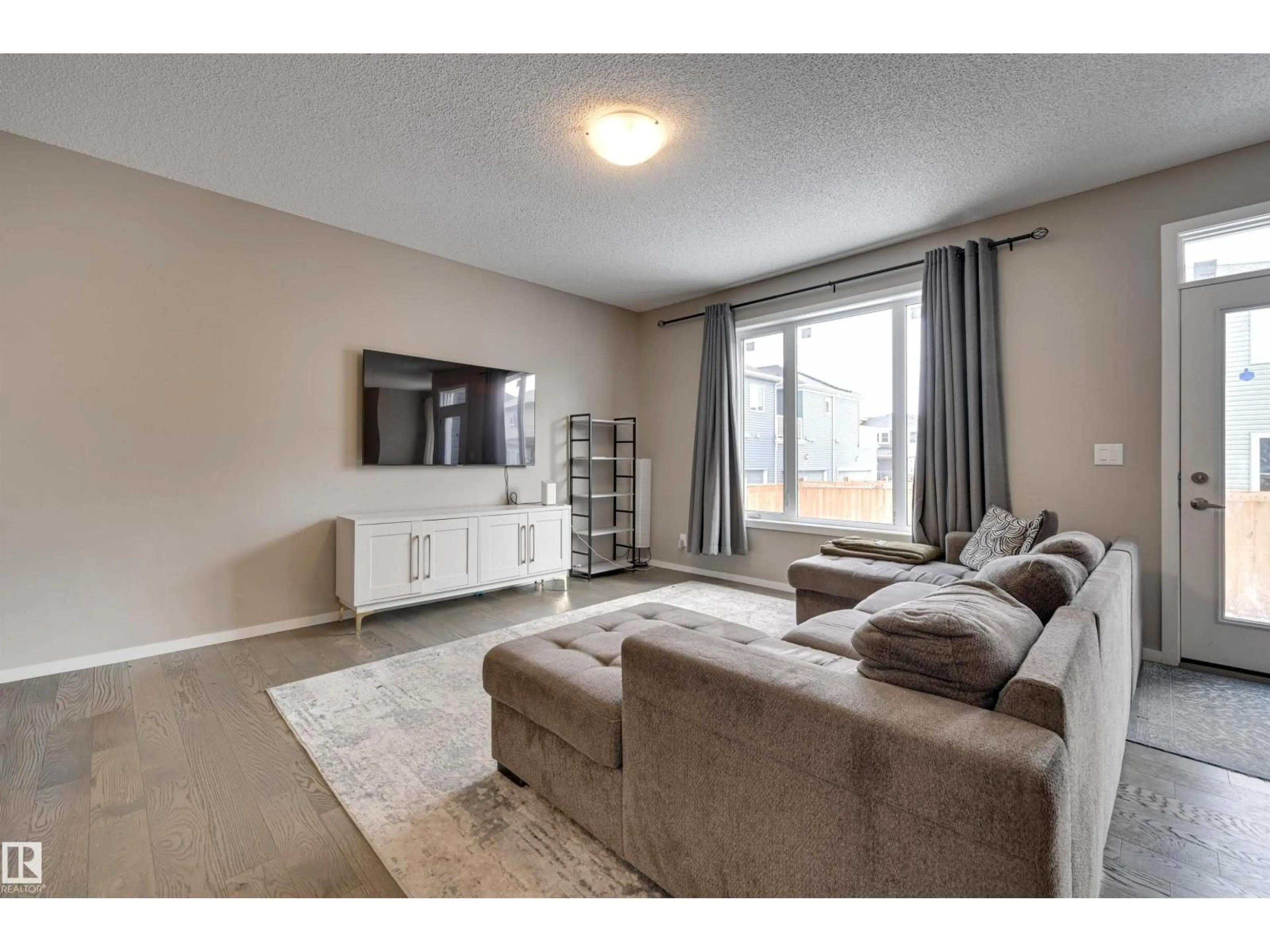 Living room with furniture, unknown for 2031 207 ST, Edmonton Alberta T6M1R7