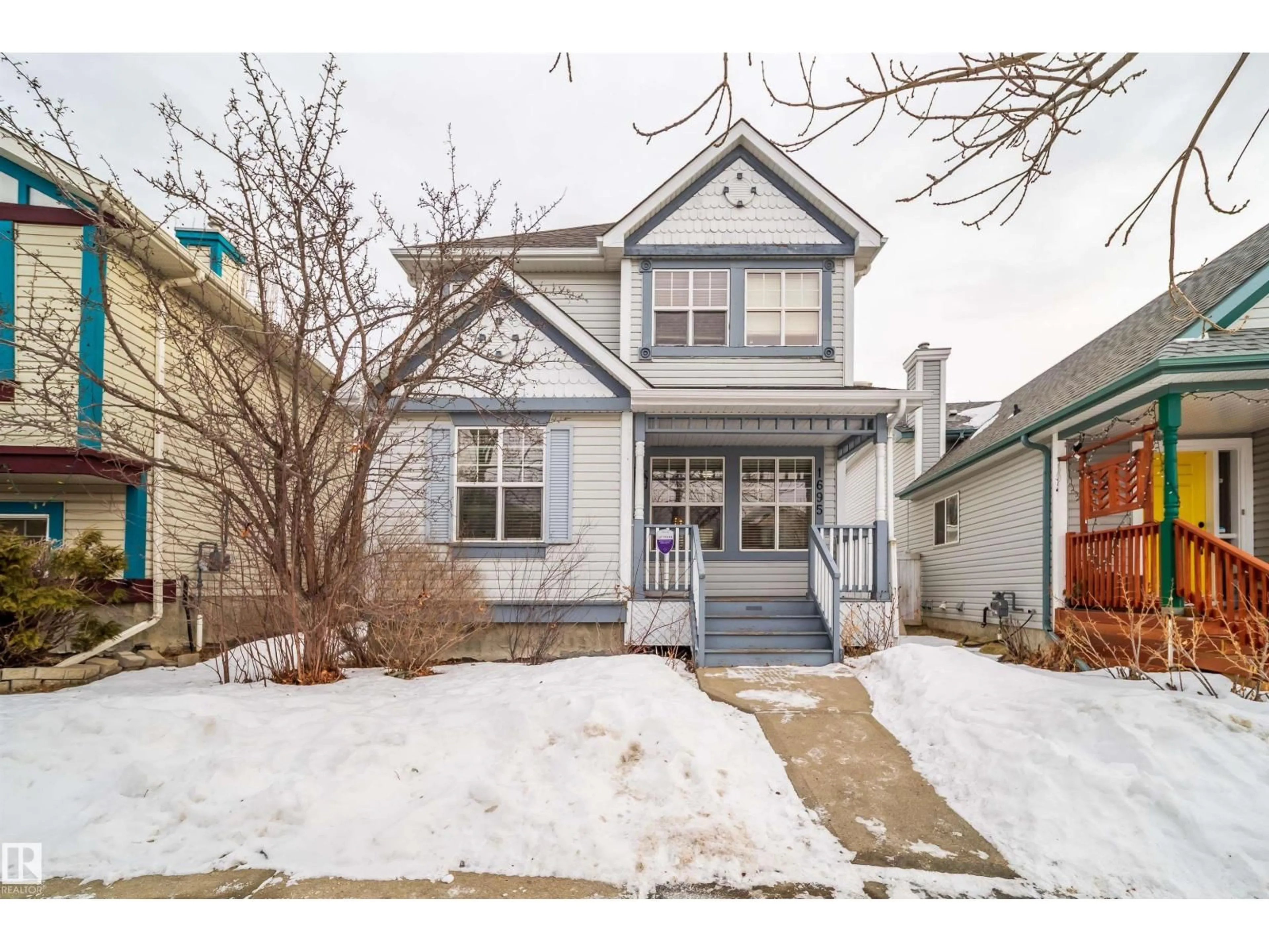 Home with vinyl exterior material, street for 1695 TOMPKINS PL, Edmonton Alberta T6R2Y4