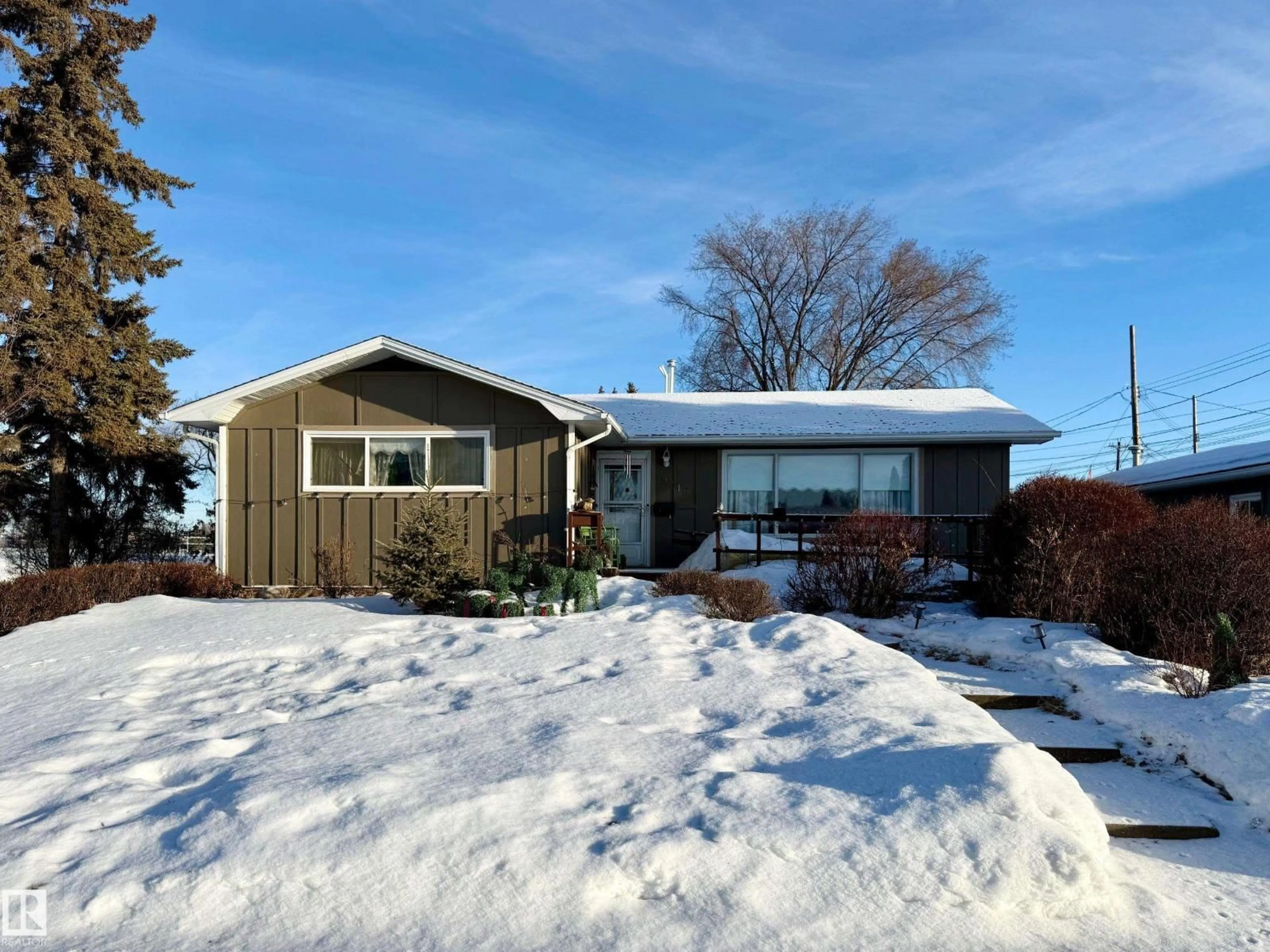 Home with vinyl exterior material, street for 9216 130 AV, Edmonton Alberta T5E0S2