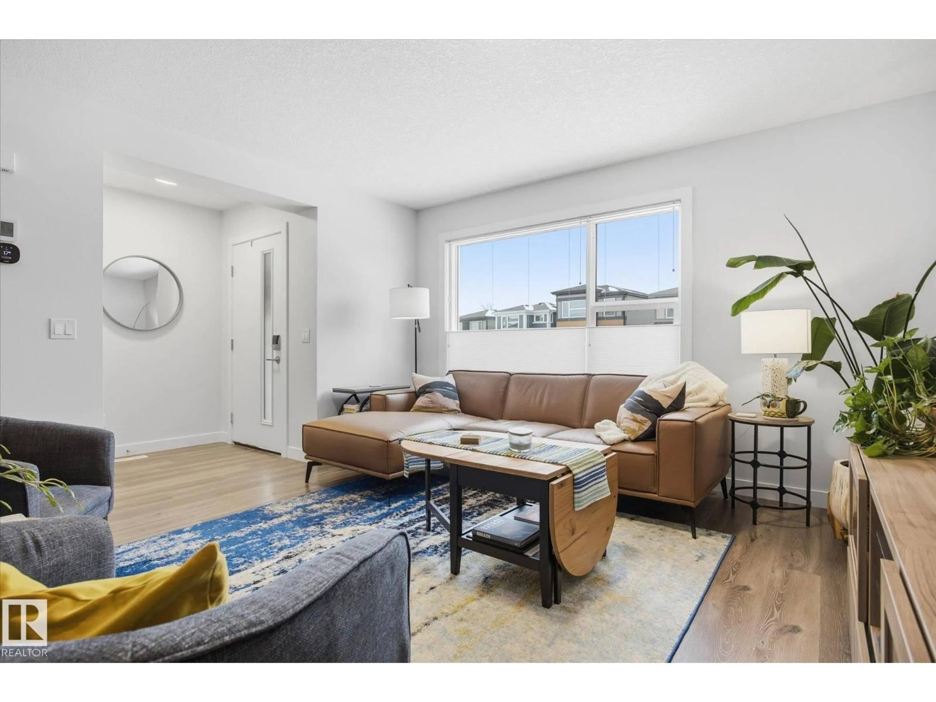 Living room with furniture, unknown for 201 CHARLESWORTH DR, Edmonton Alberta T6X2W2