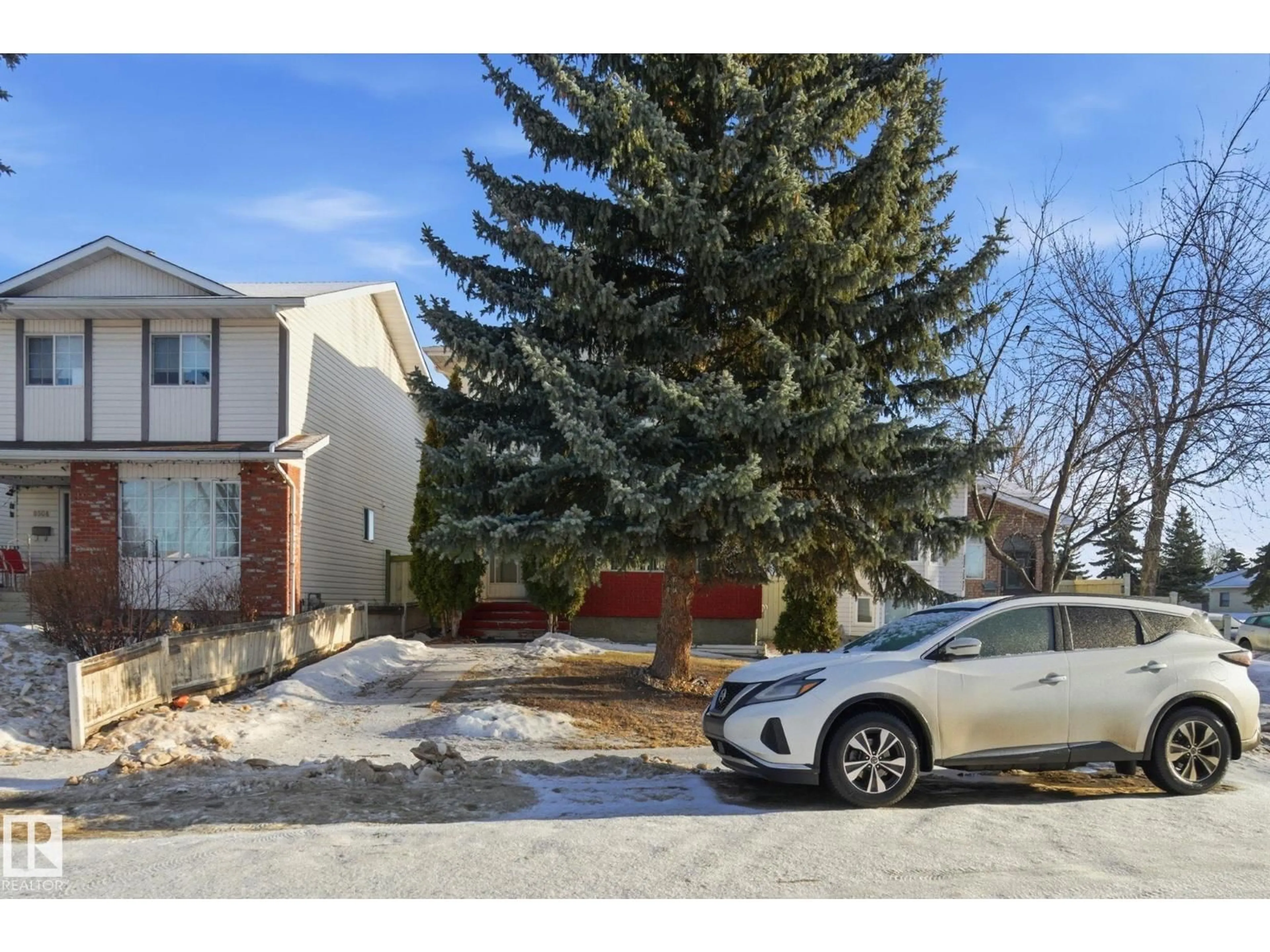 A pic from outside/outdoor area/front of a property/back of a property/a pic from drone, street for 8006 15A AV, Edmonton Alberta T6K4E3