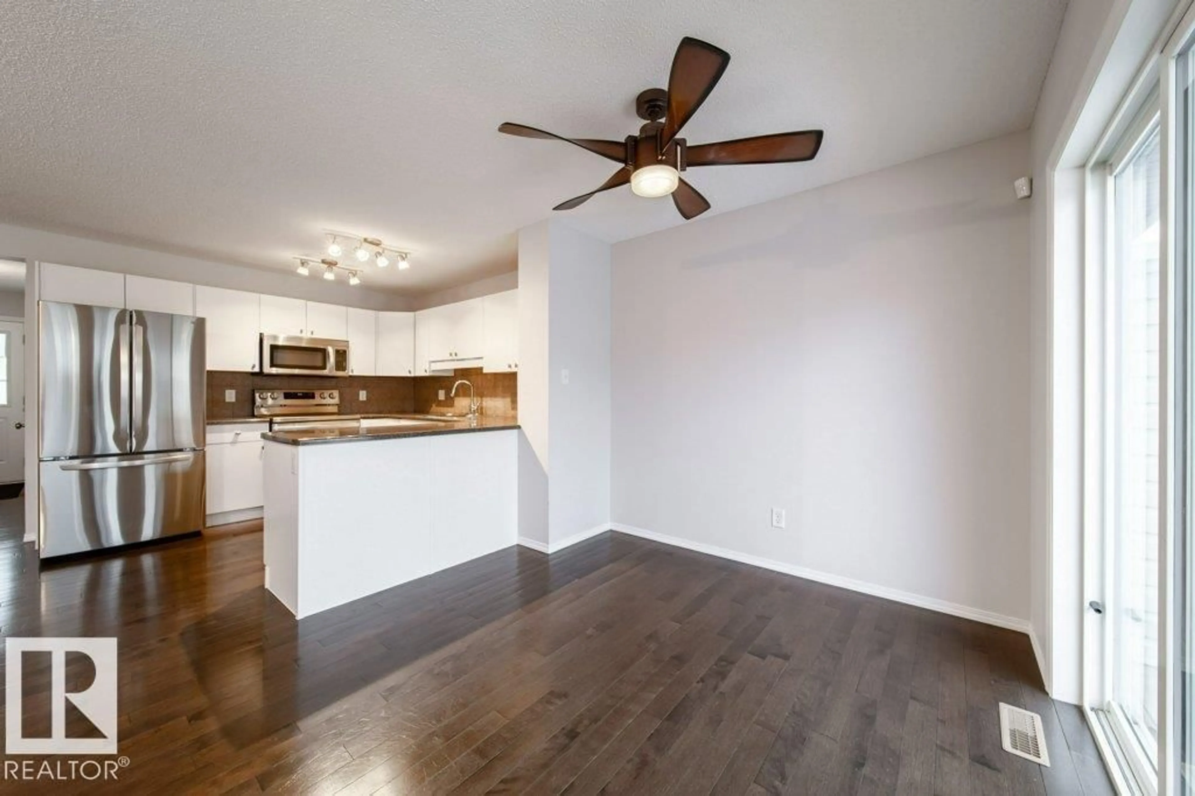 Open concept kitchen, wood/laminate floor for #62 - 6304 SANDIN WY, Edmonton Alberta T6R0J8