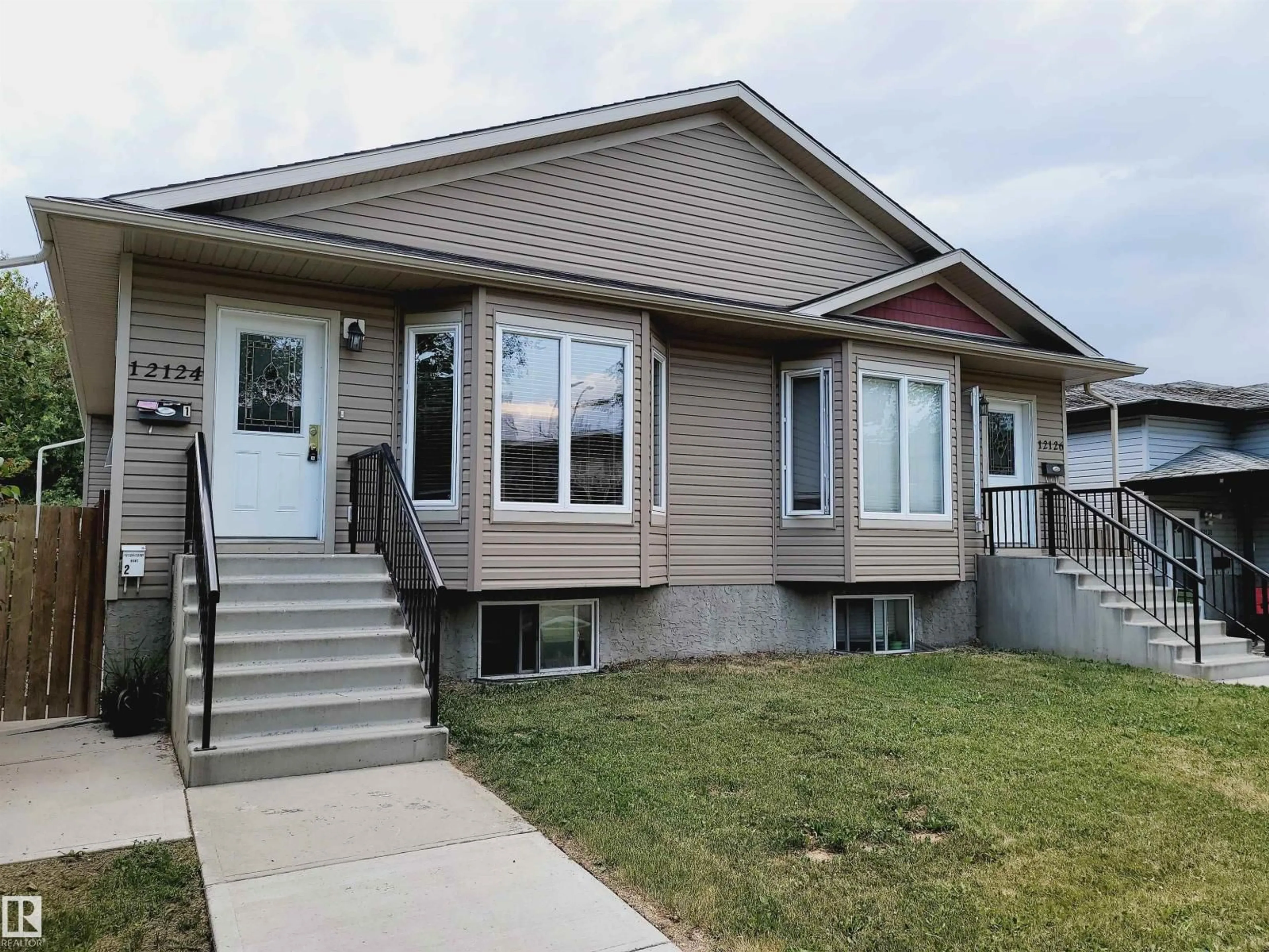 Home with vinyl exterior material, street for 12124 122 ST, Edmonton Alberta T5L0C8