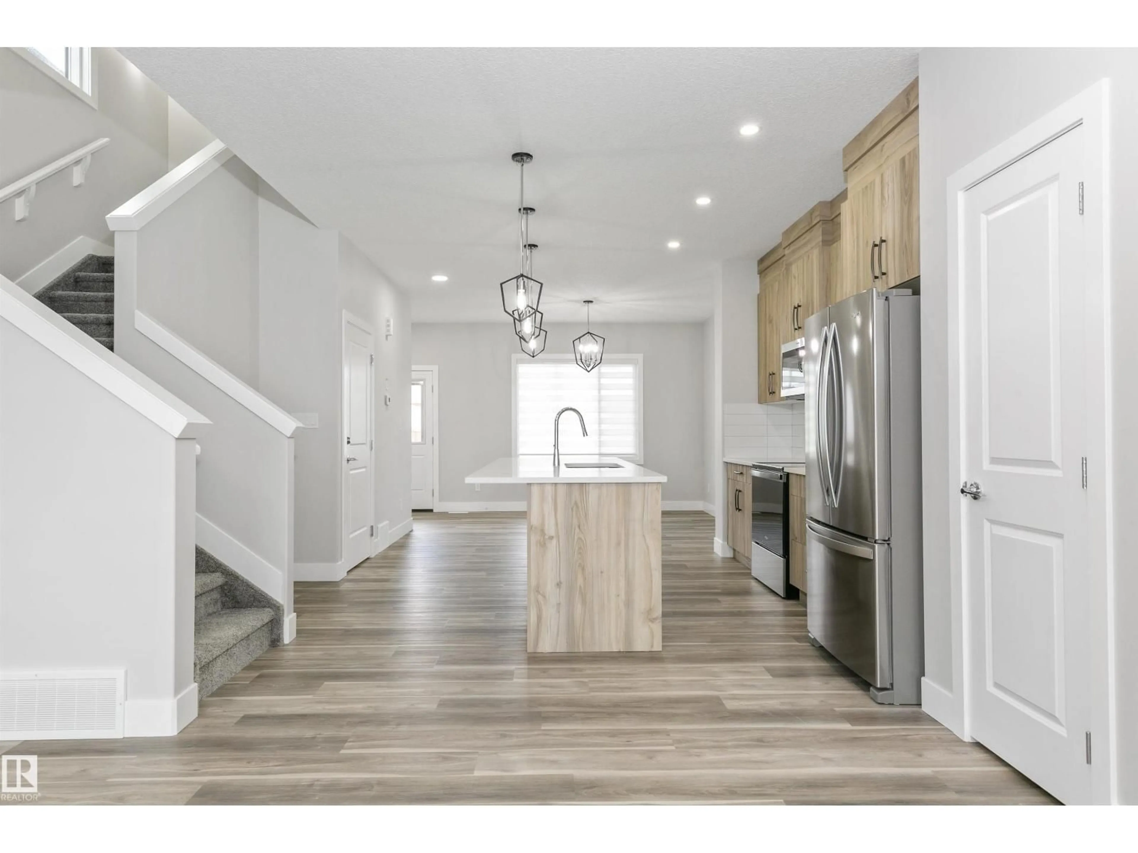 Open concept kitchen, wood/laminate floor for 5060 CHAPPELLE RD, Edmonton Alberta T6W4H7