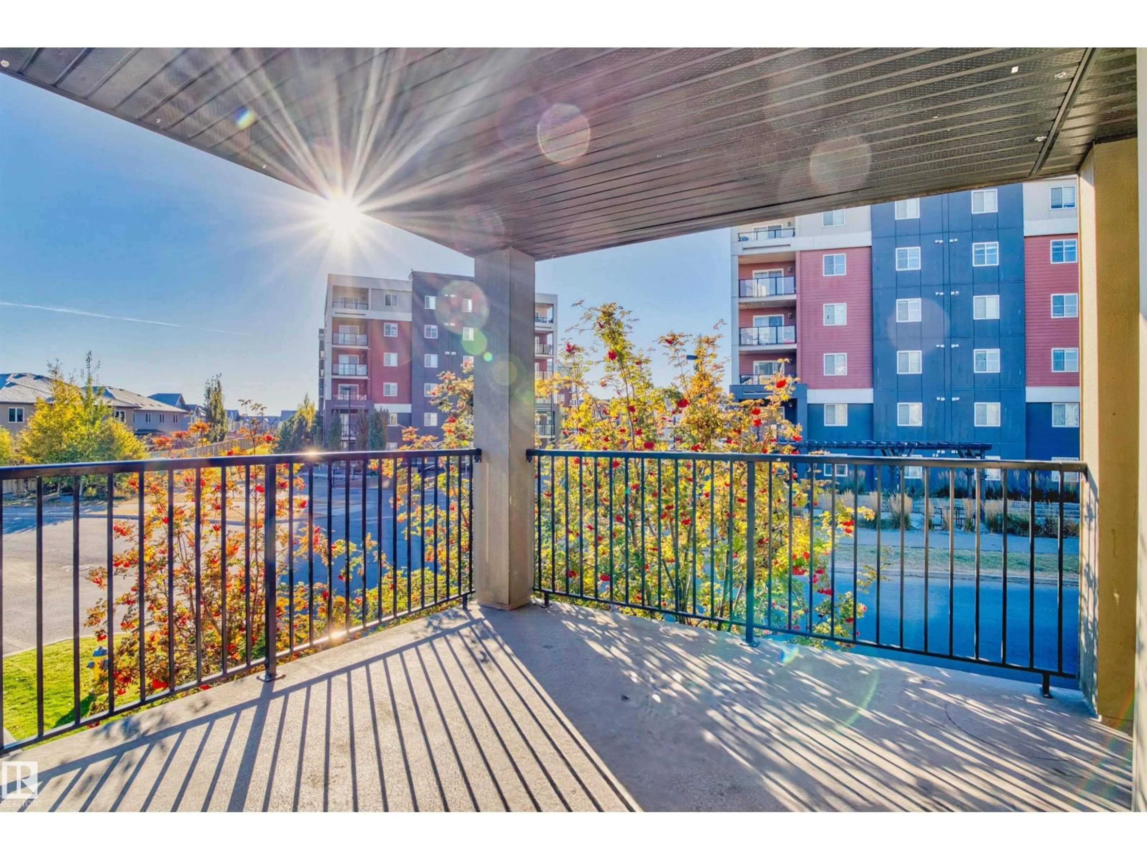 Balcony in the apartment, city buildings view from balcony for 202 - 3315 JAMES MOWATT TR, Edmonton Alberta T6W3L9