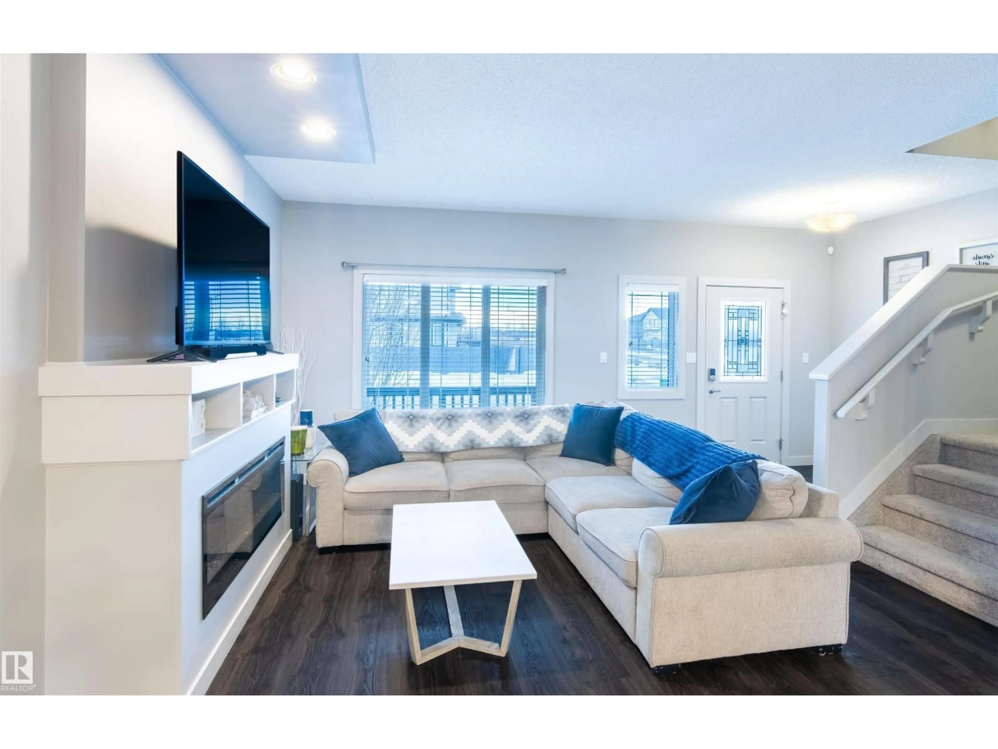 Living room with furniture, wood/laminate floor for 888 CY BECKER DR, Edmonton Alberta T5Y3P3