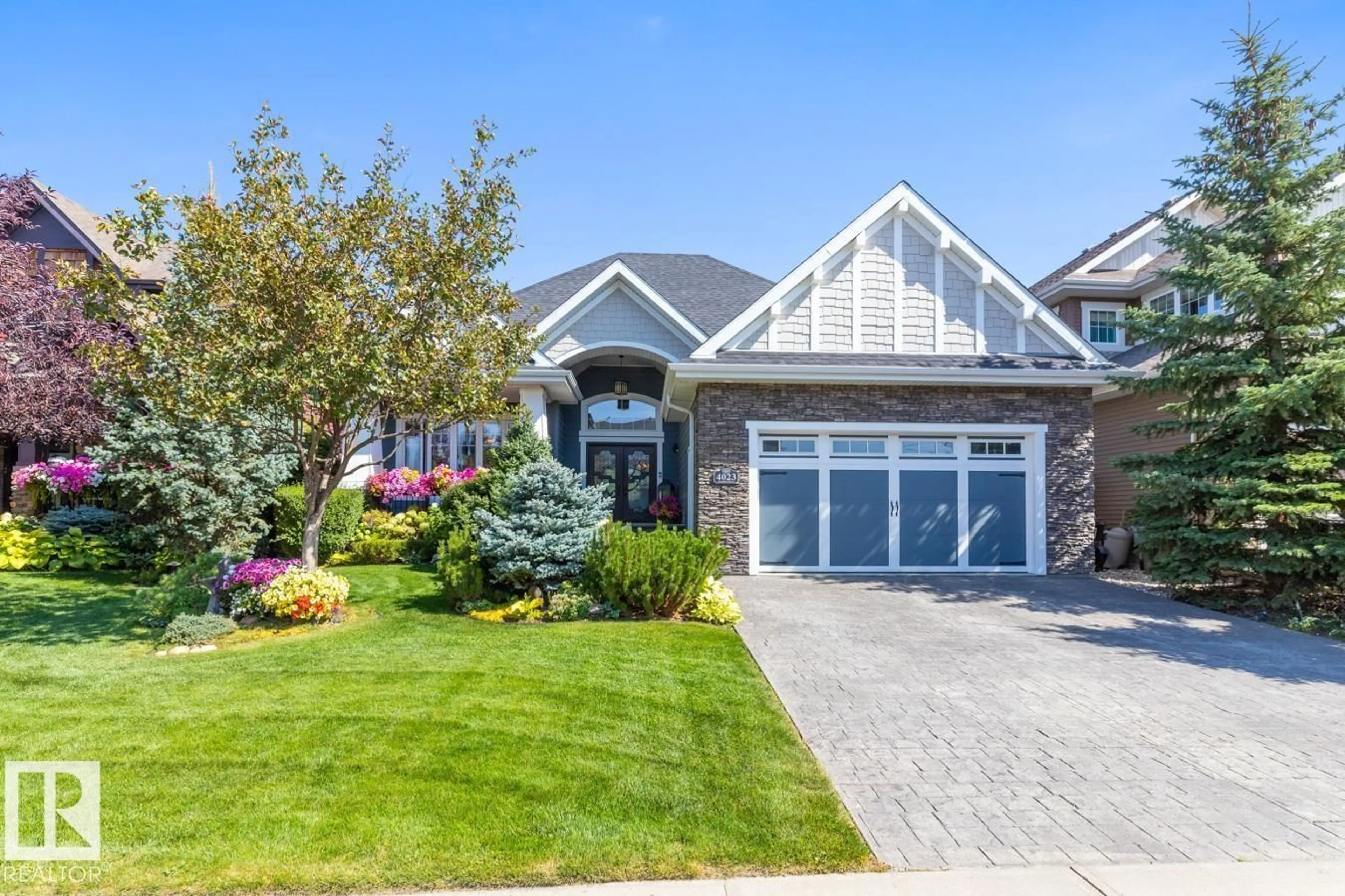 Home with brick exterior material, street for 4023 WHISPERING RIVER DR, Edmonton Alberta T6W0T5