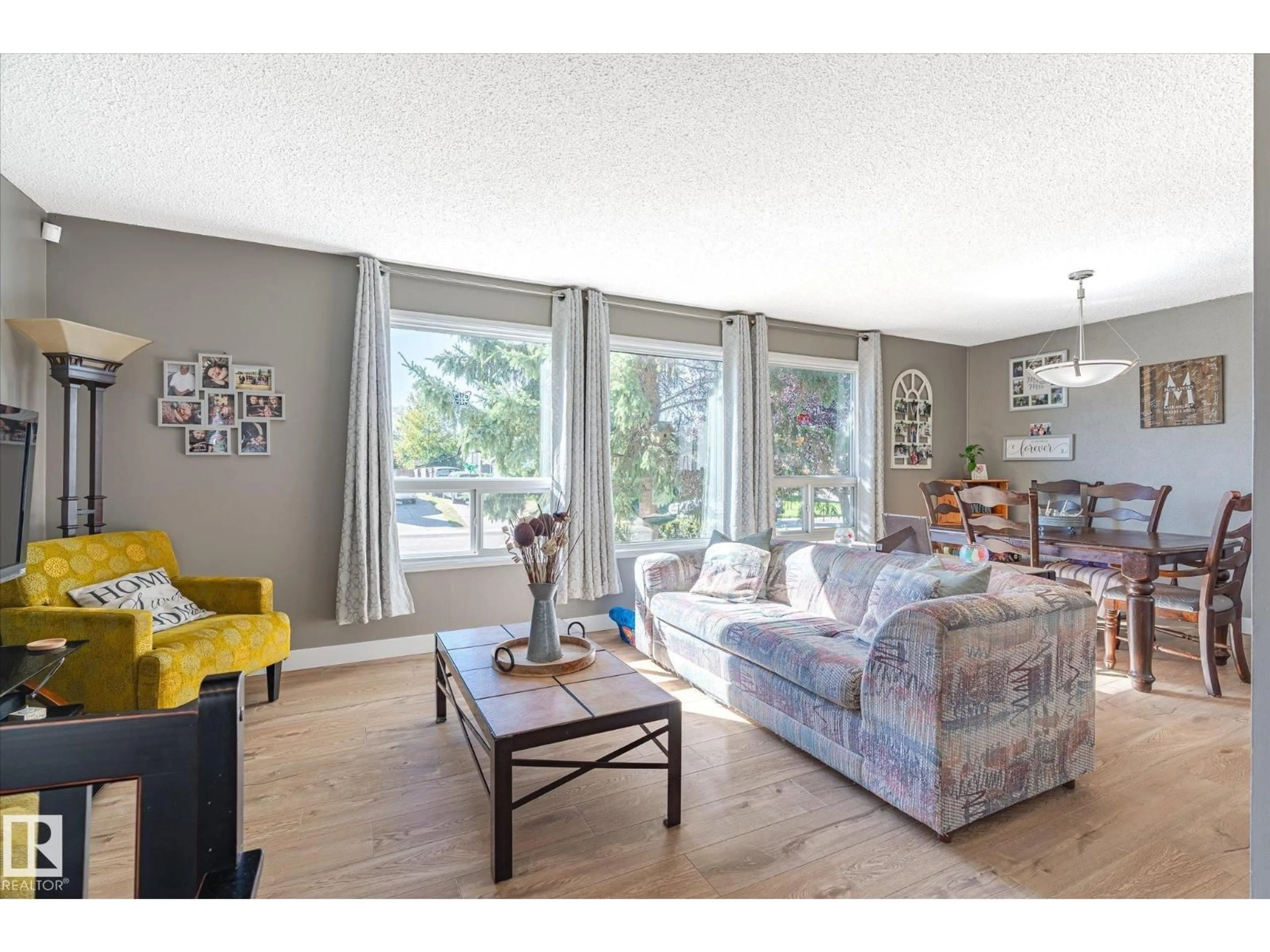 Living room with furniture, wood/laminate floor for 9209 82 ST, Fort Saskatchewan Alberta T8L3R1