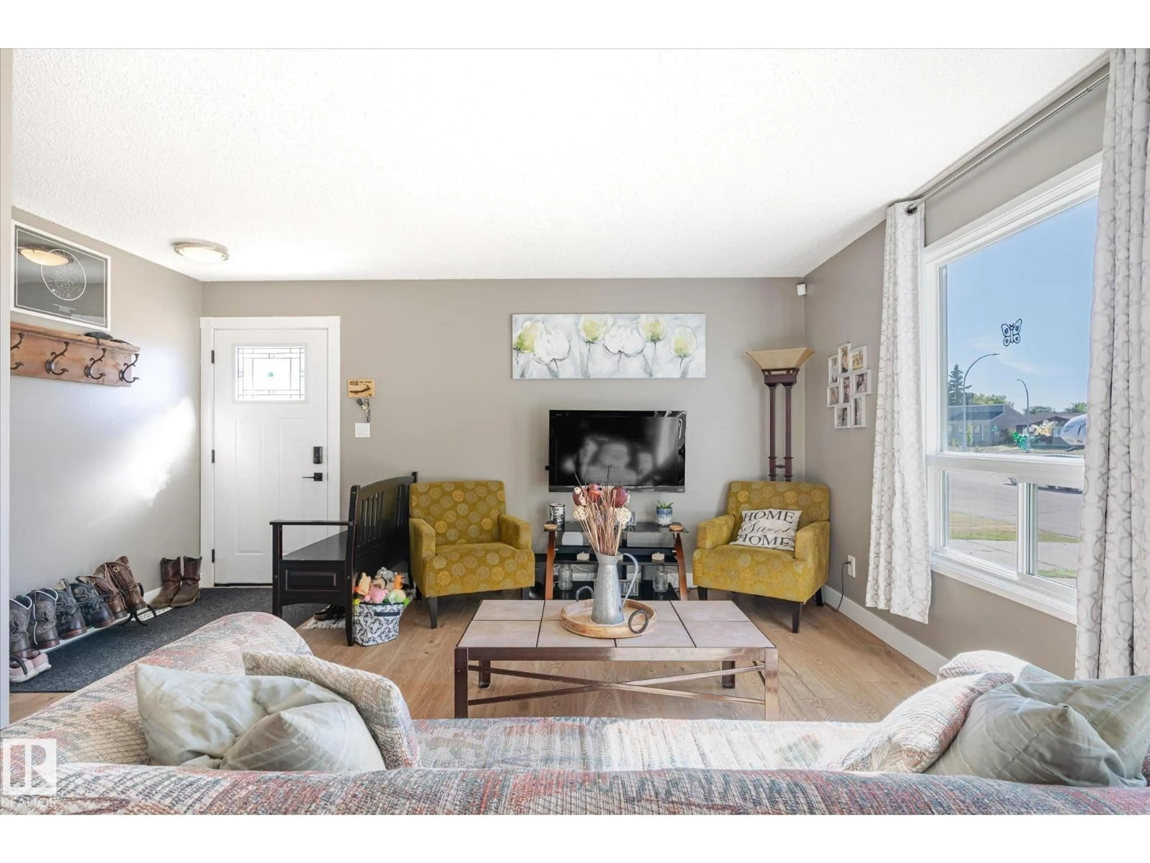 Living room with furniture, wood/laminate floor for 9209 82 ST, Fort Saskatchewan Alberta T8L3R1