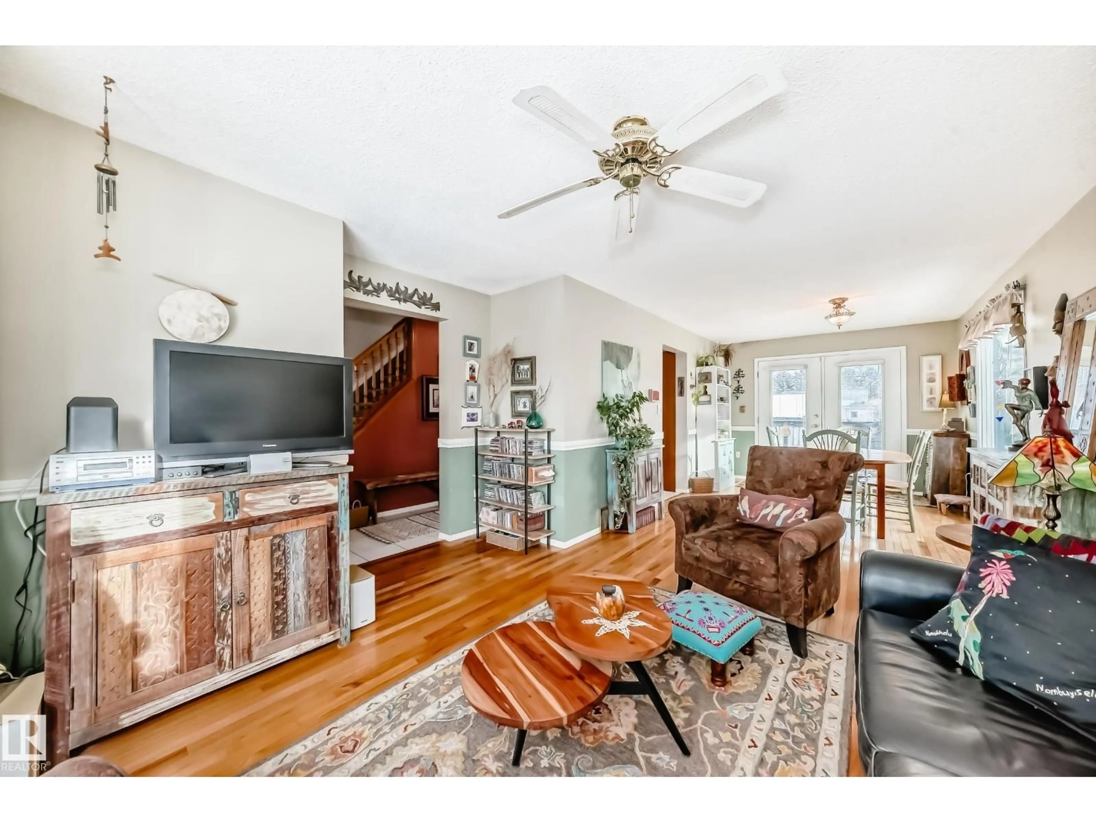 Living room with furniture, wood/laminate floor for 11415 71 ST, Edmonton Alberta T5B1V8