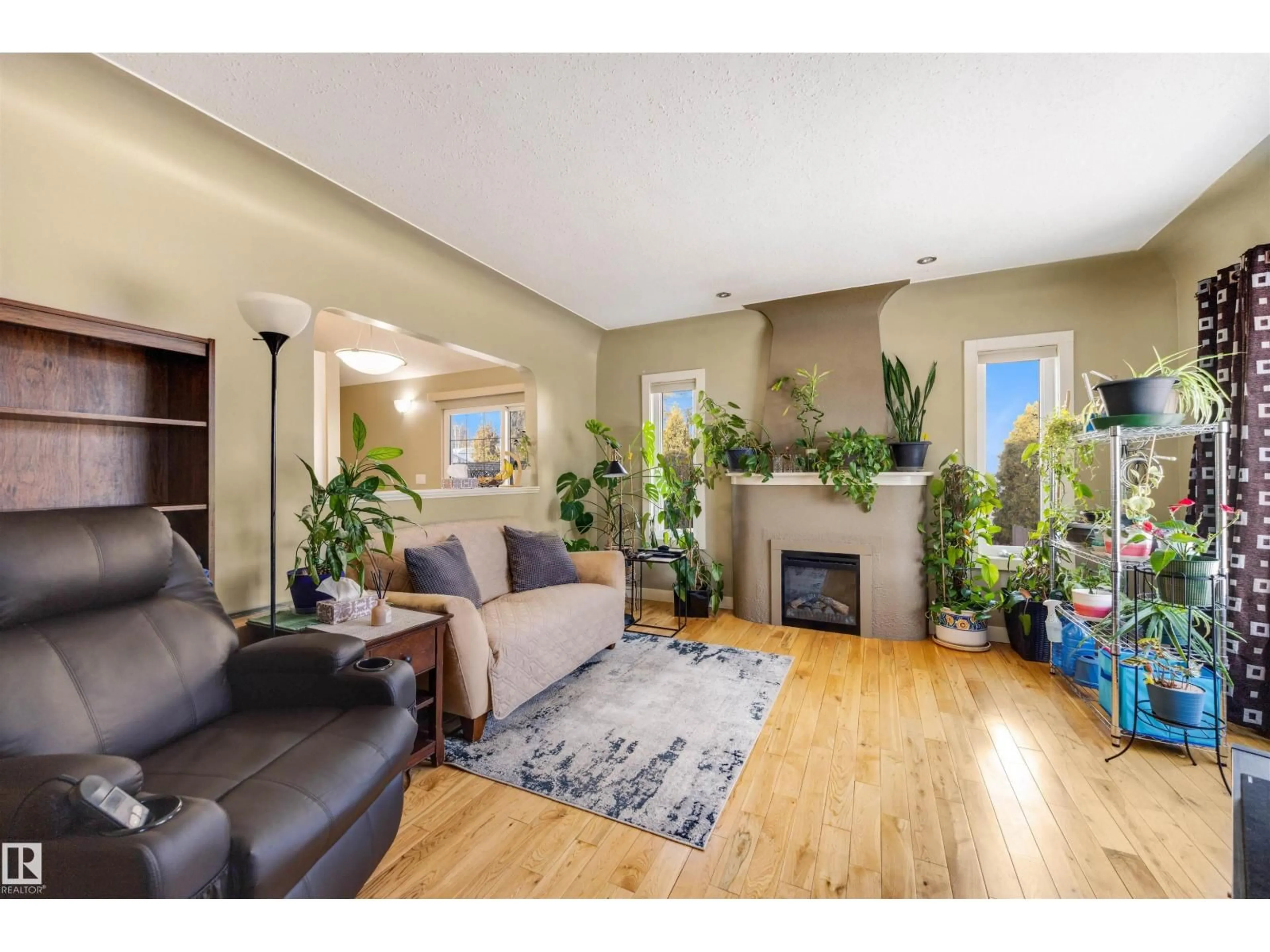 Living room with furniture, wood/laminate floor for NW - 11822 125 ST, Edmonton Alberta T5L0R9