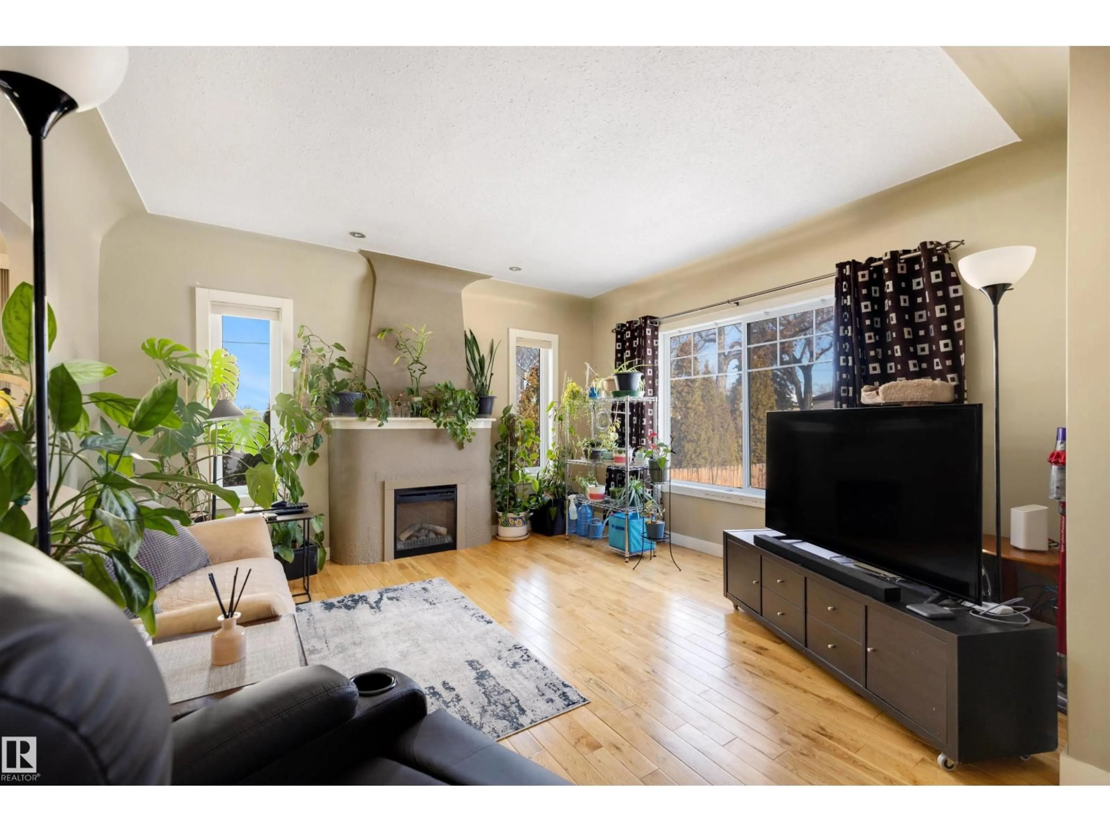 Living room with furniture, wood/laminate floor for NW - 11822 125 ST, Edmonton Alberta T5L0R9