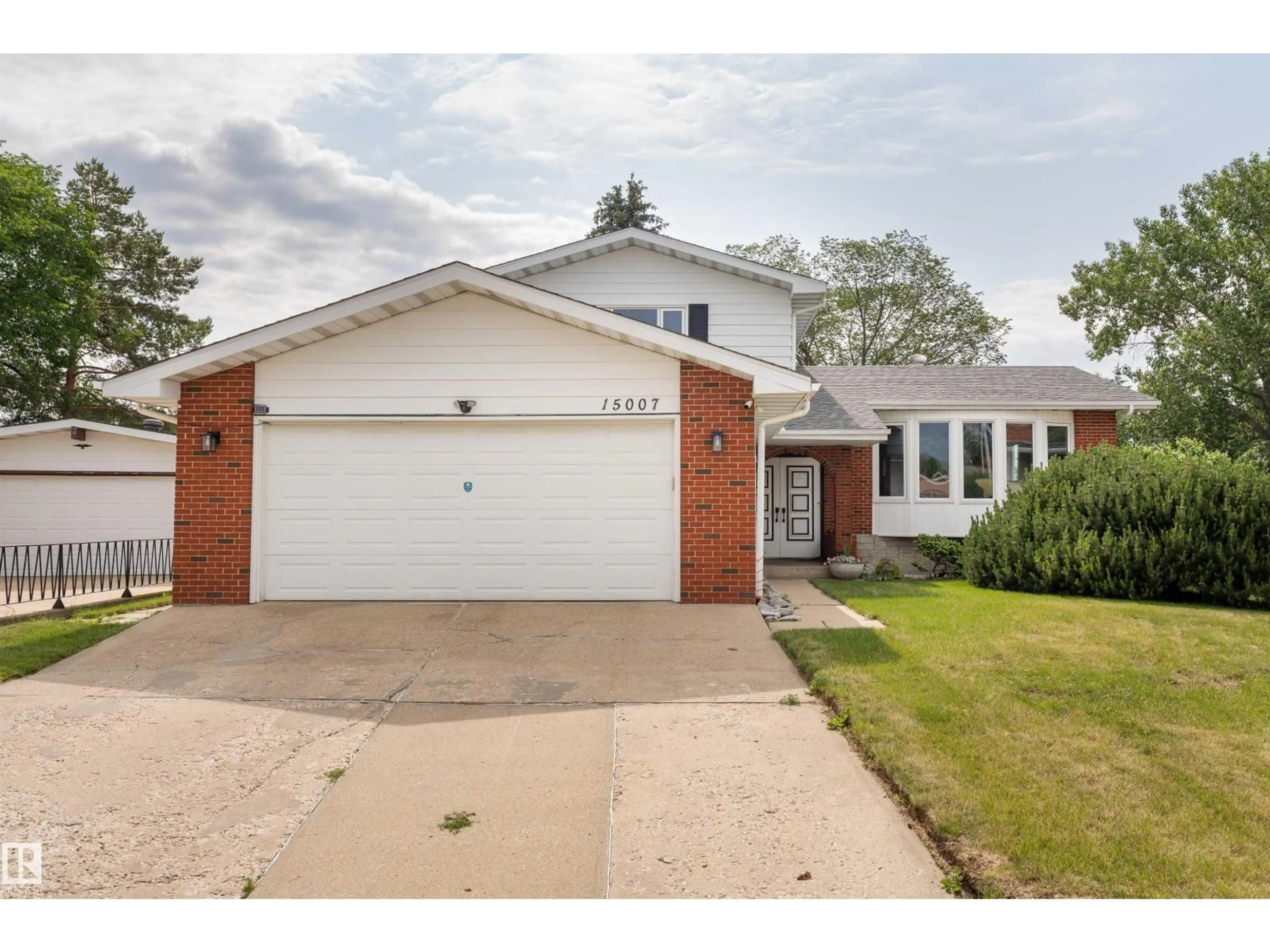 Home with brick exterior material, street for 15007 115 ST, Edmonton Alberta T5X1H9