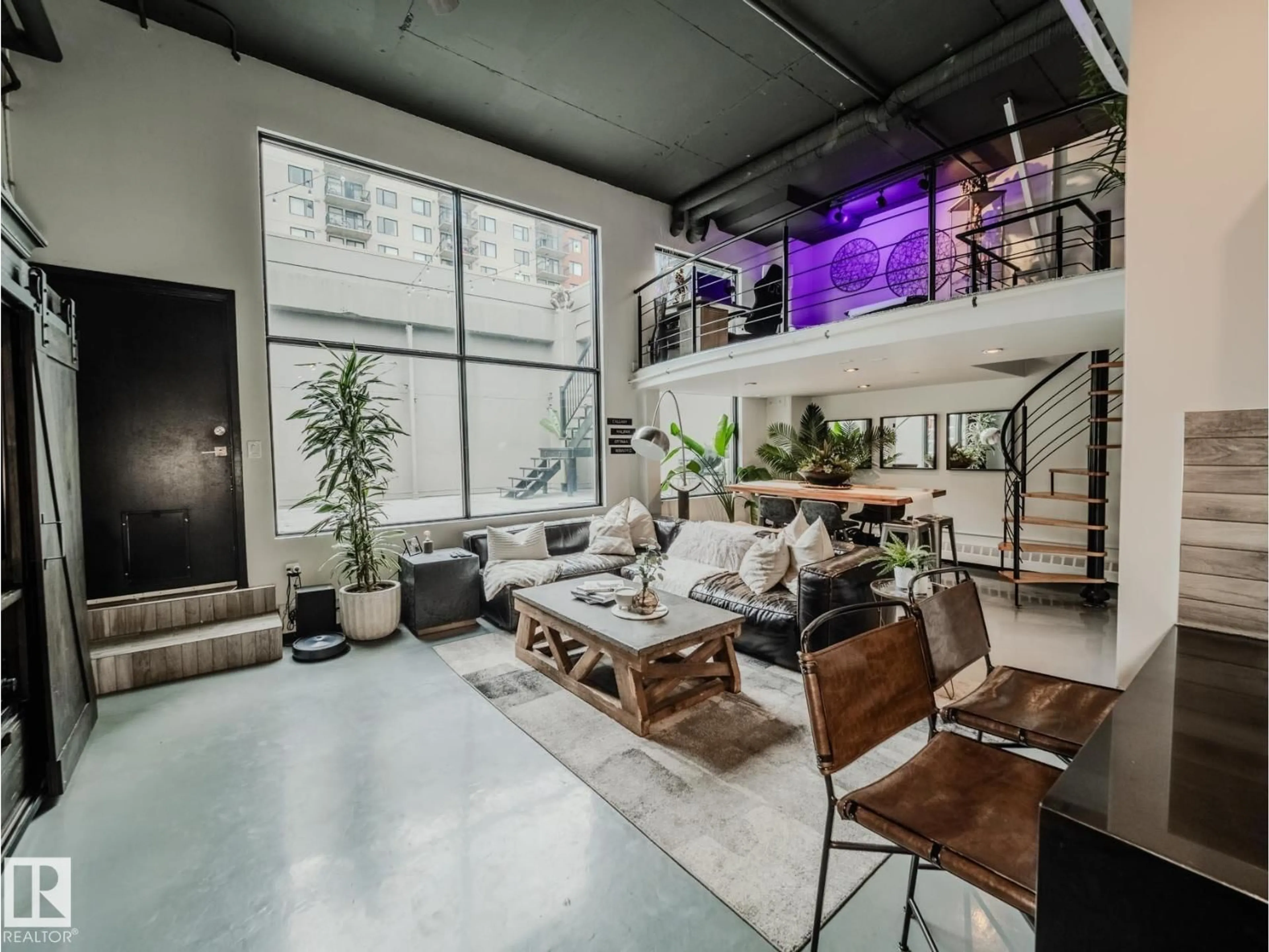 Living room with furniture, cement floor for 1001 10179 105 ST NW, Edmonton Alberta T5J3N1