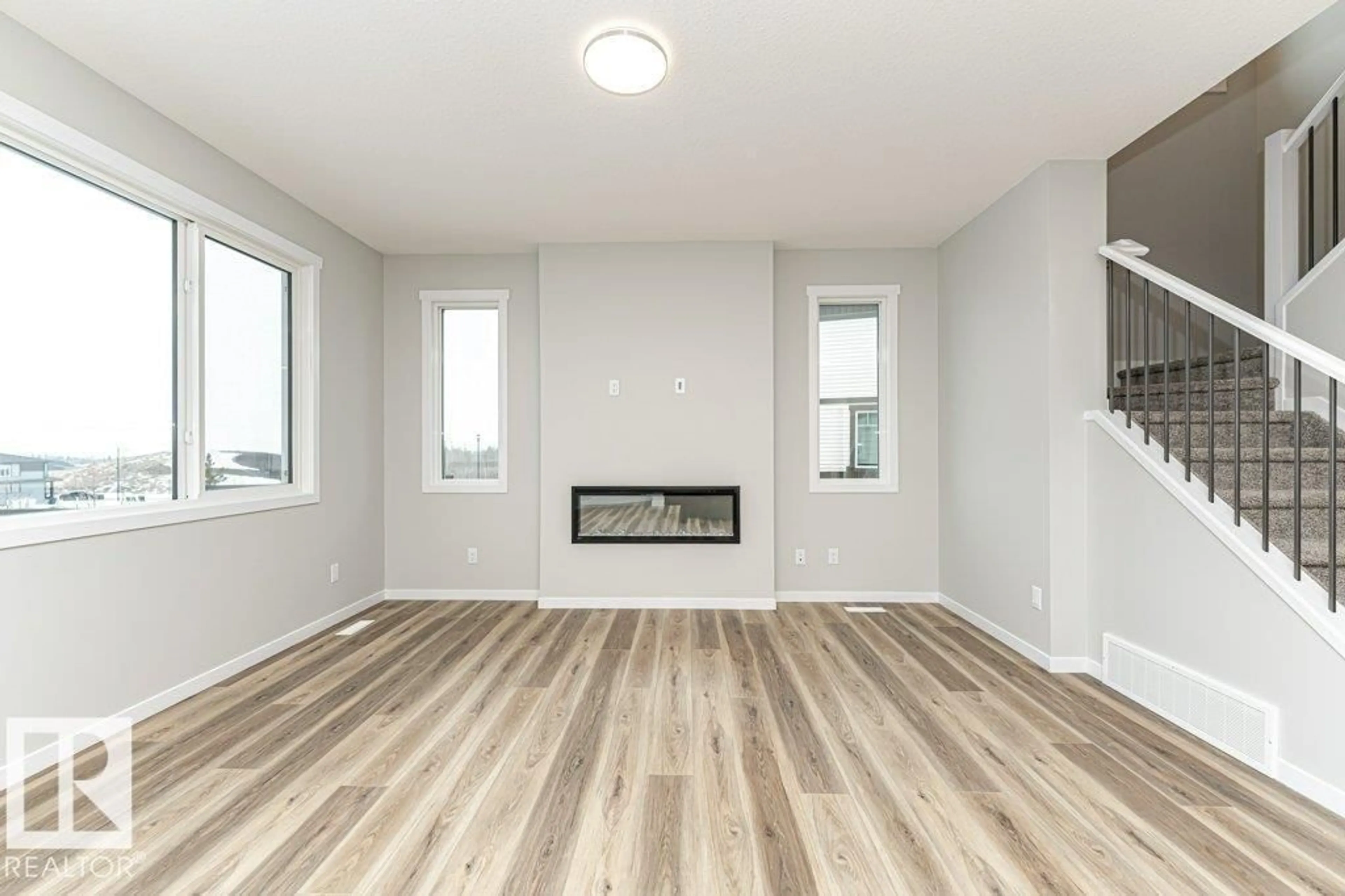 Living room with furniture, wood/laminate floor for NW - 3949 WREN LO, Edmonton Alberta T5S0T1