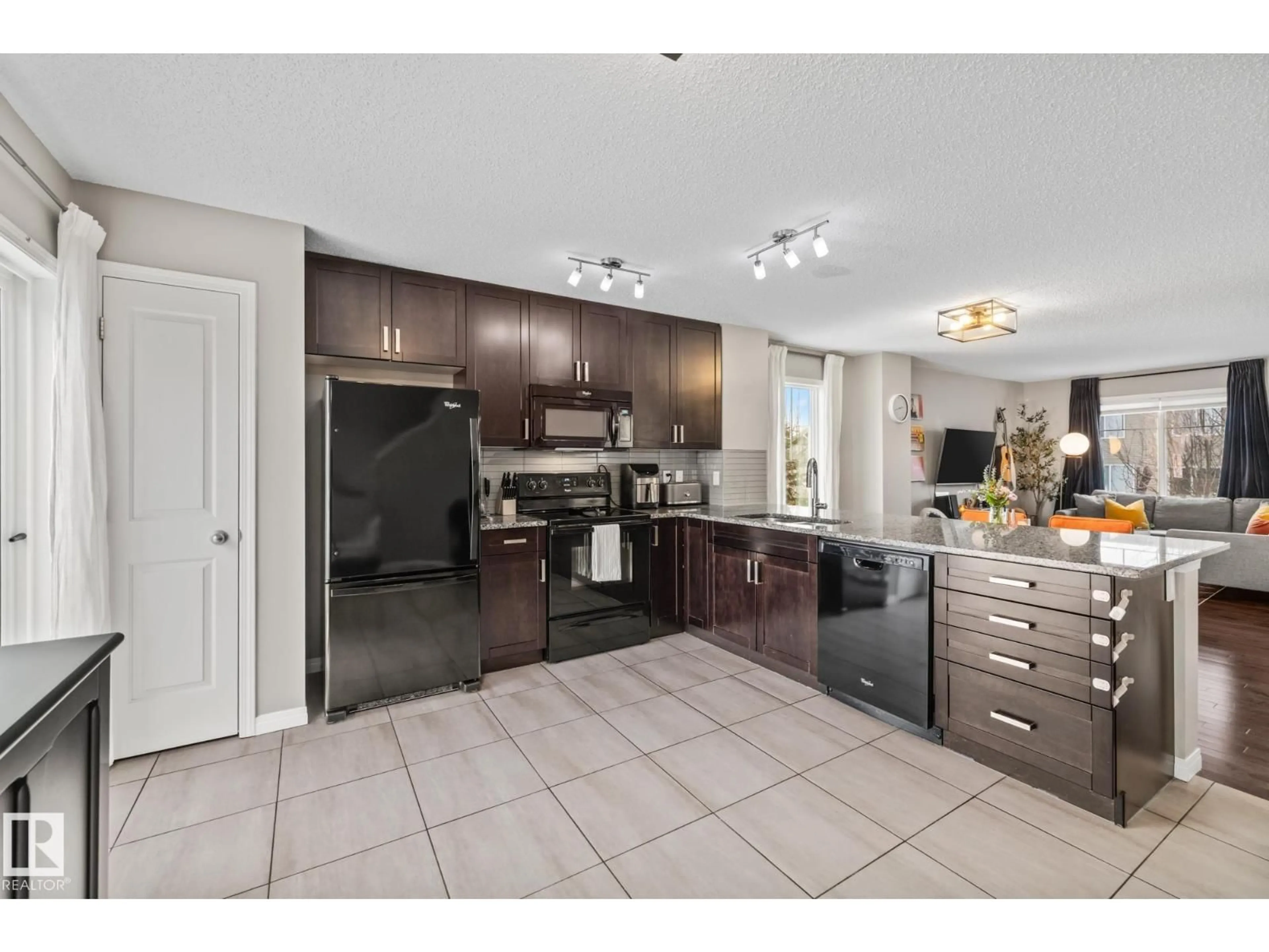 Open concept kitchen, ceramic/tile floor for 18 1140 CHAPPELLE BV, Edmonton Alberta T6W2Z3