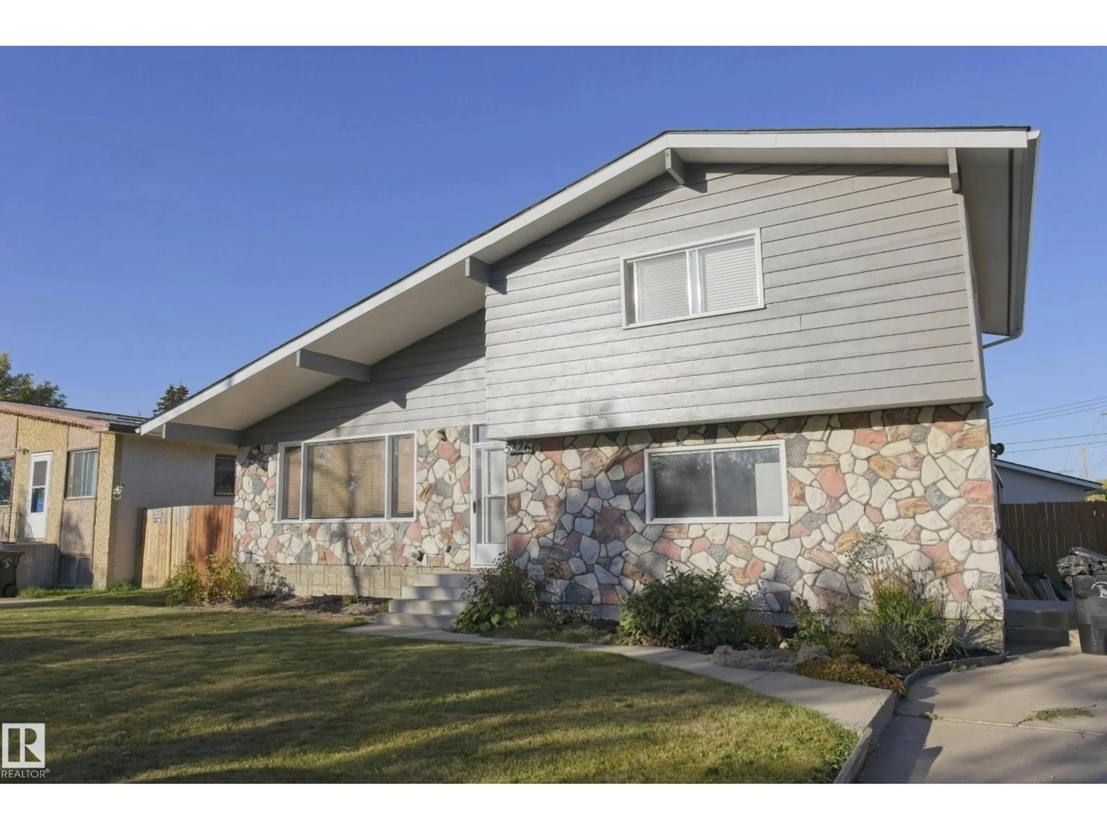 Home with vinyl exterior material, street for 5226 43 ST, Barrhead Alberta T7N1J7