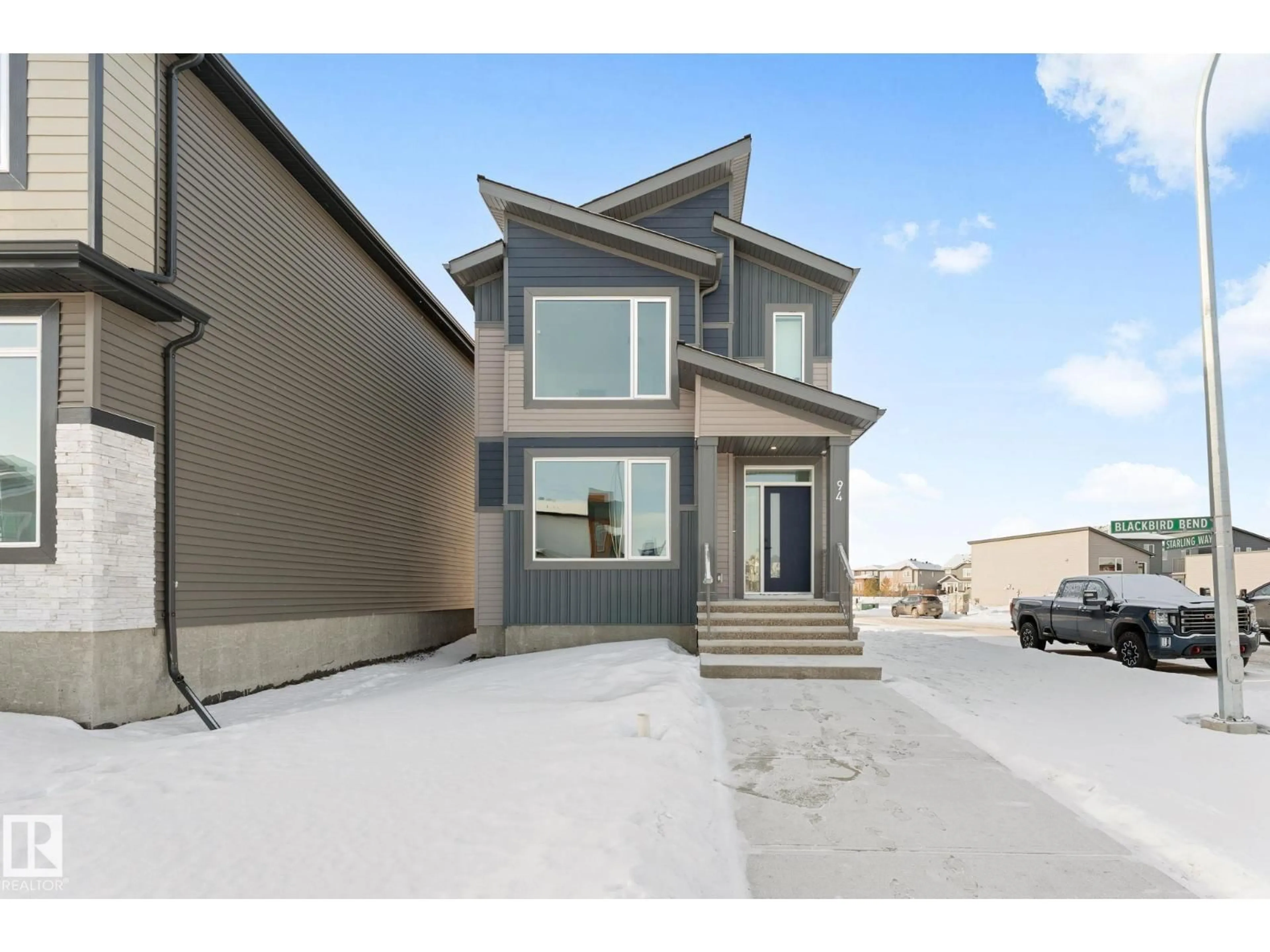 Home with vinyl exterior material, street for 94 BLACKBIRD BEND, Fort Saskatchewan Alberta T8L0X9