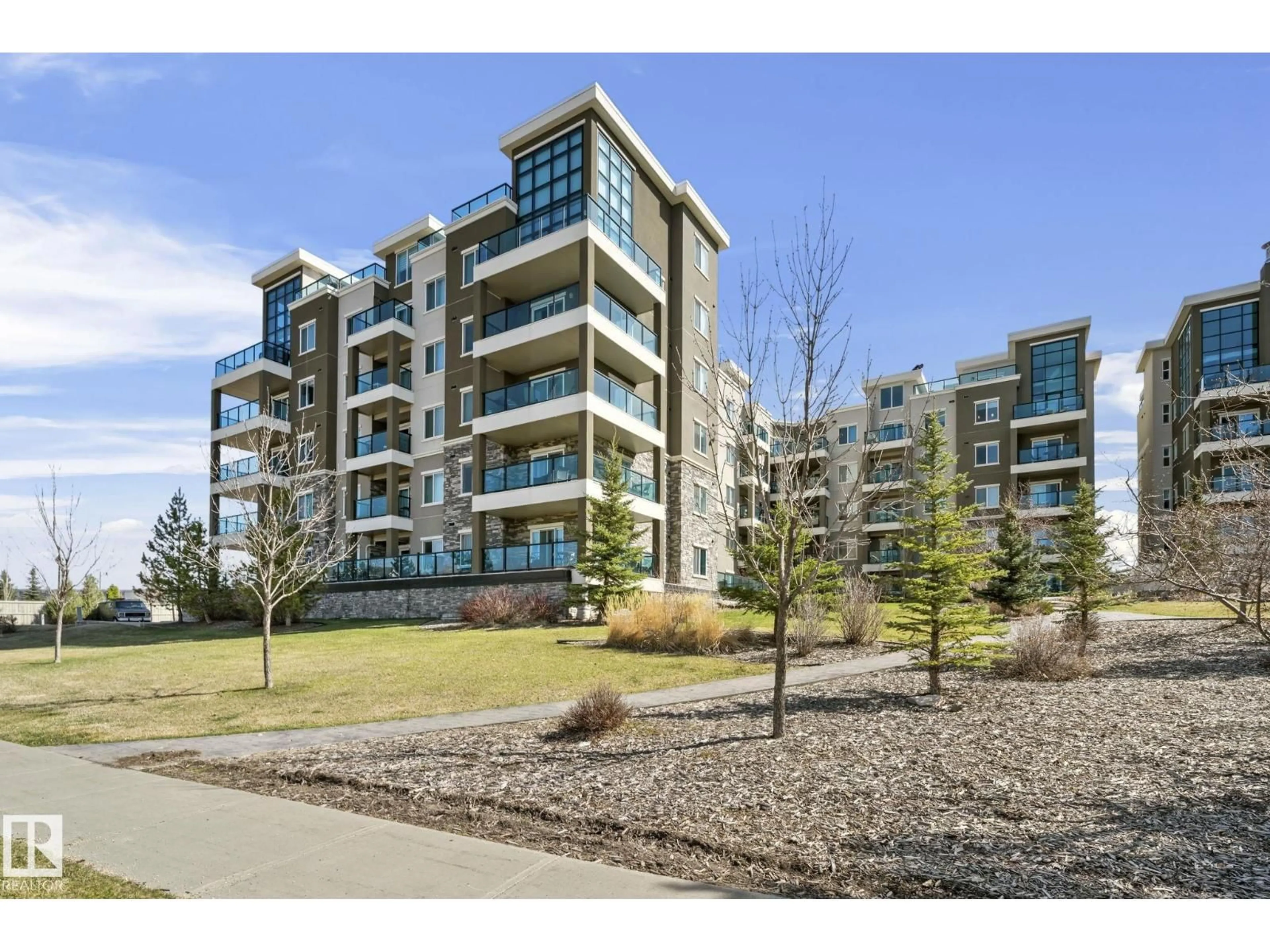 A pic from outside/outdoor area/front of a property/back of a property/a pic from drone, unknown for #114 - 1230 WINDERMERE WY, Edmonton Alberta T6W2J3