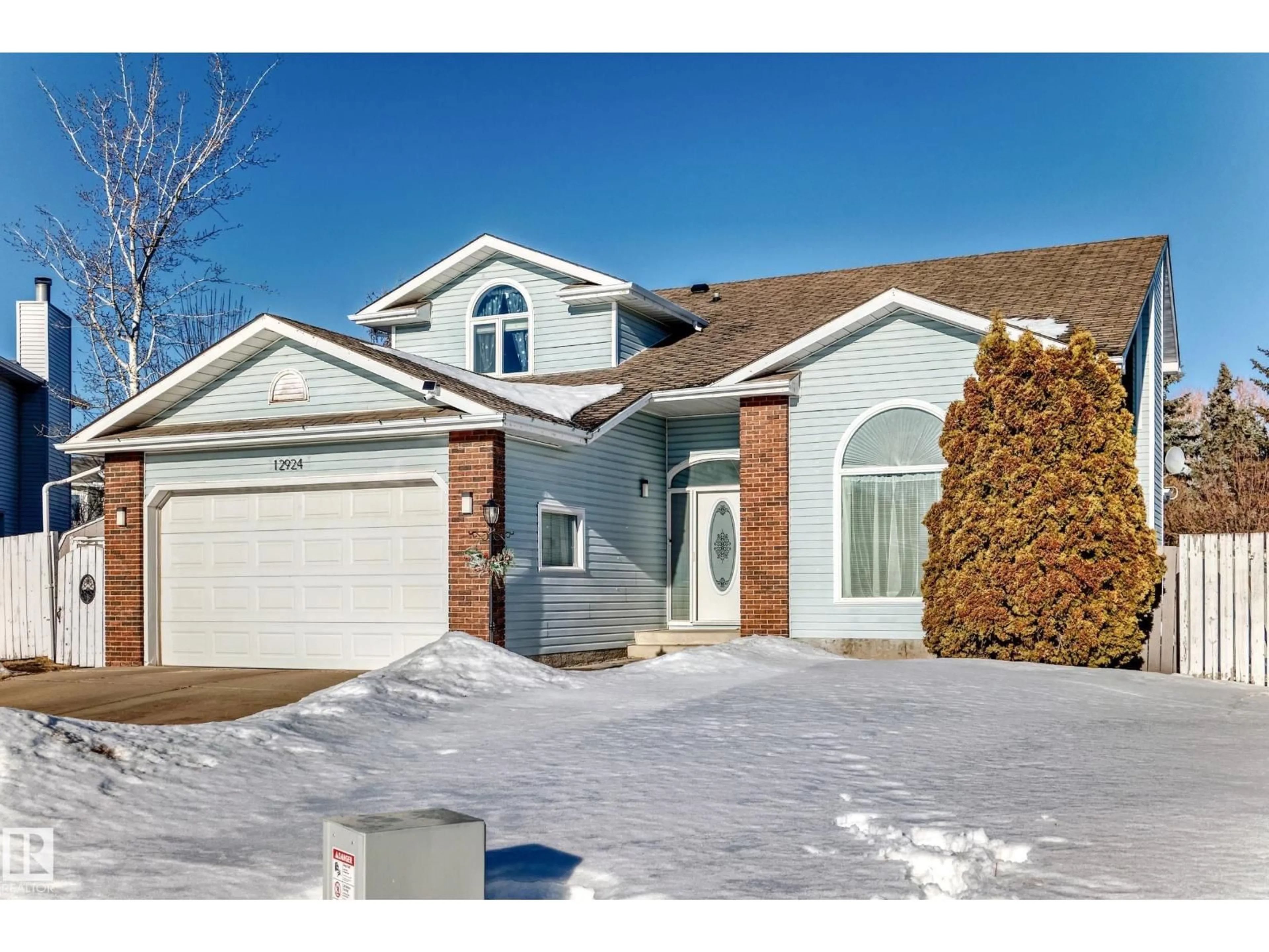 Home with vinyl exterior material, street for 12924 157 AV, Edmonton Alberta T6V1A4