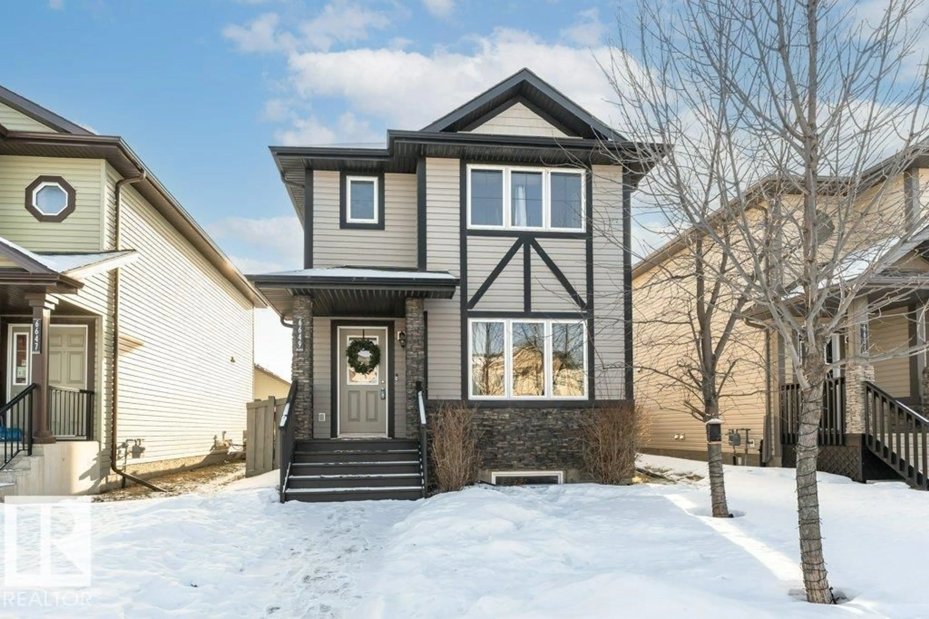 Home with vinyl exterior material, street for 6649 CARDINAL RD SW, Edmonton Alberta T6W1Y8