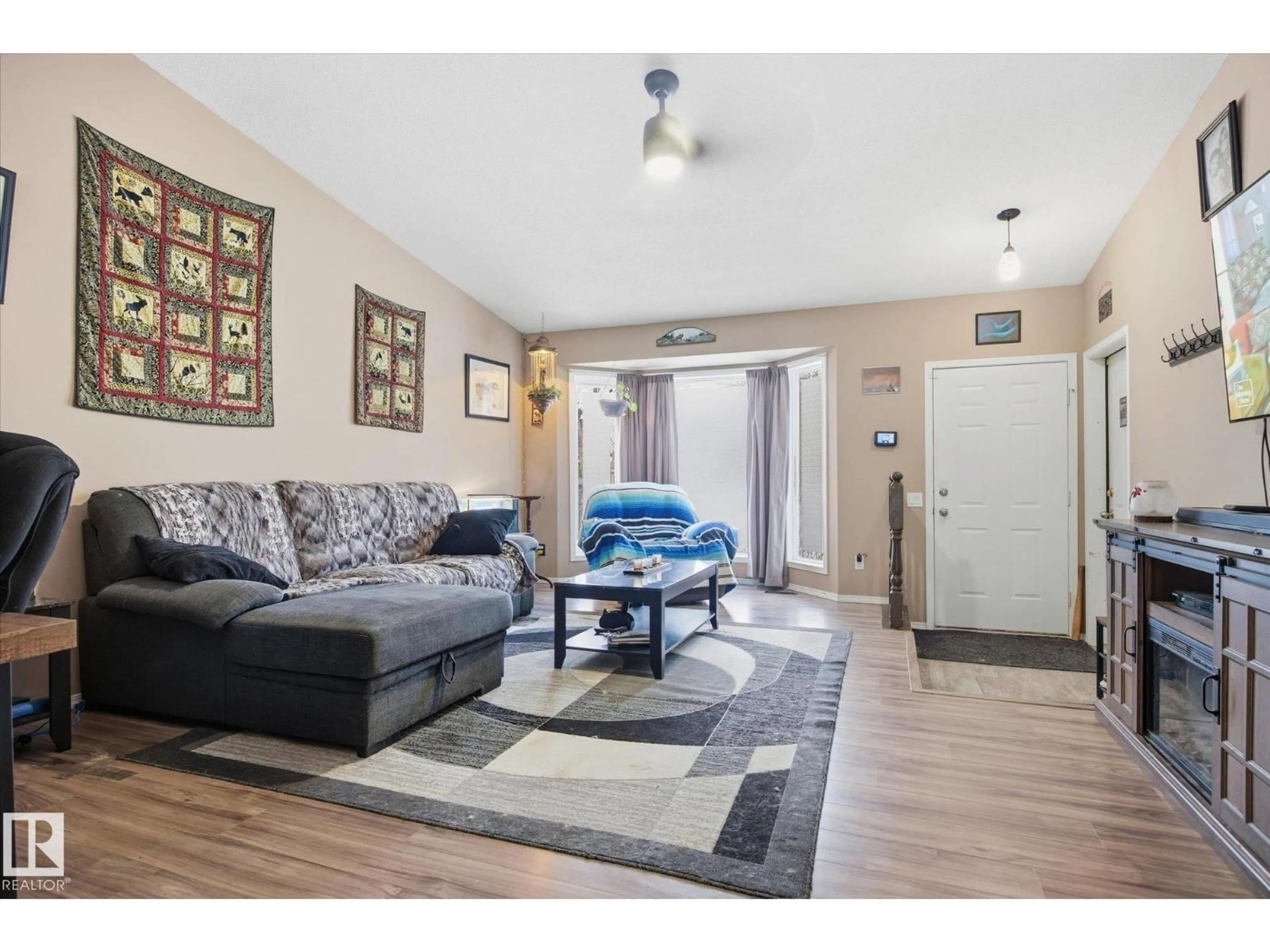 Living room with furniture, wood/laminate floor for A - 67 ARBOR CR, St. Albert Alberta T8N2T8