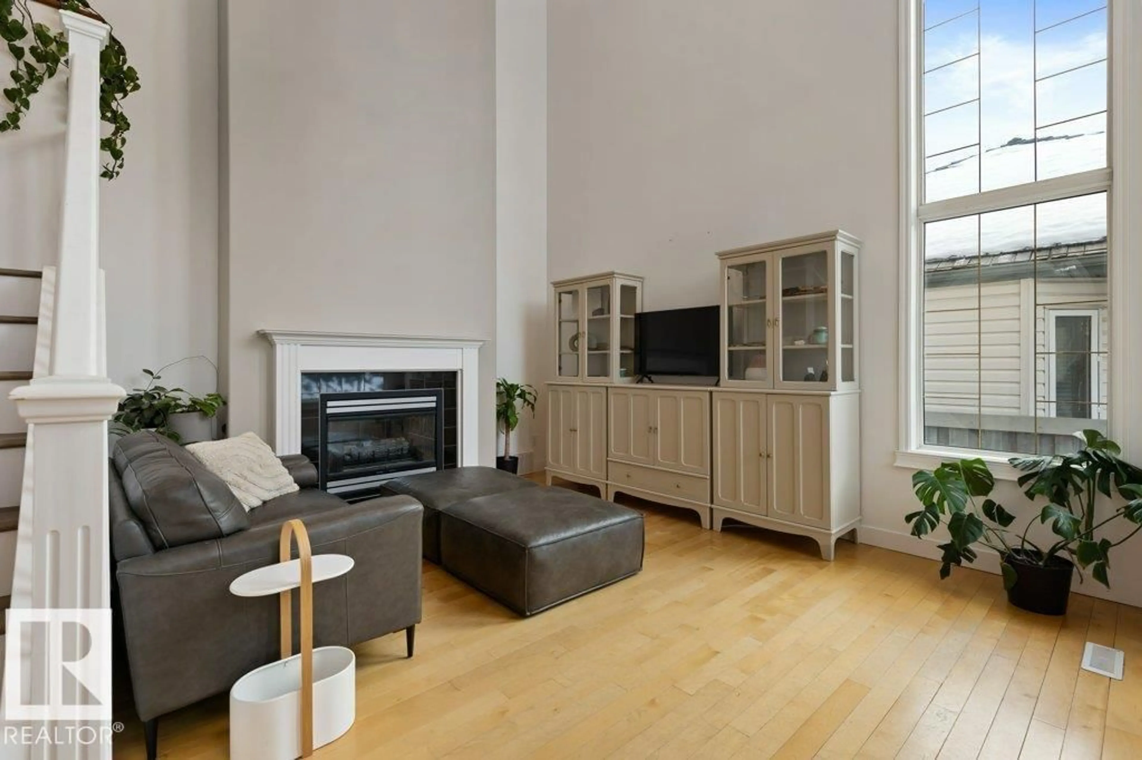 Living room with furniture, wood/laminate floor for 22 OTTER CR, St. Albert Alberta T8N6N6