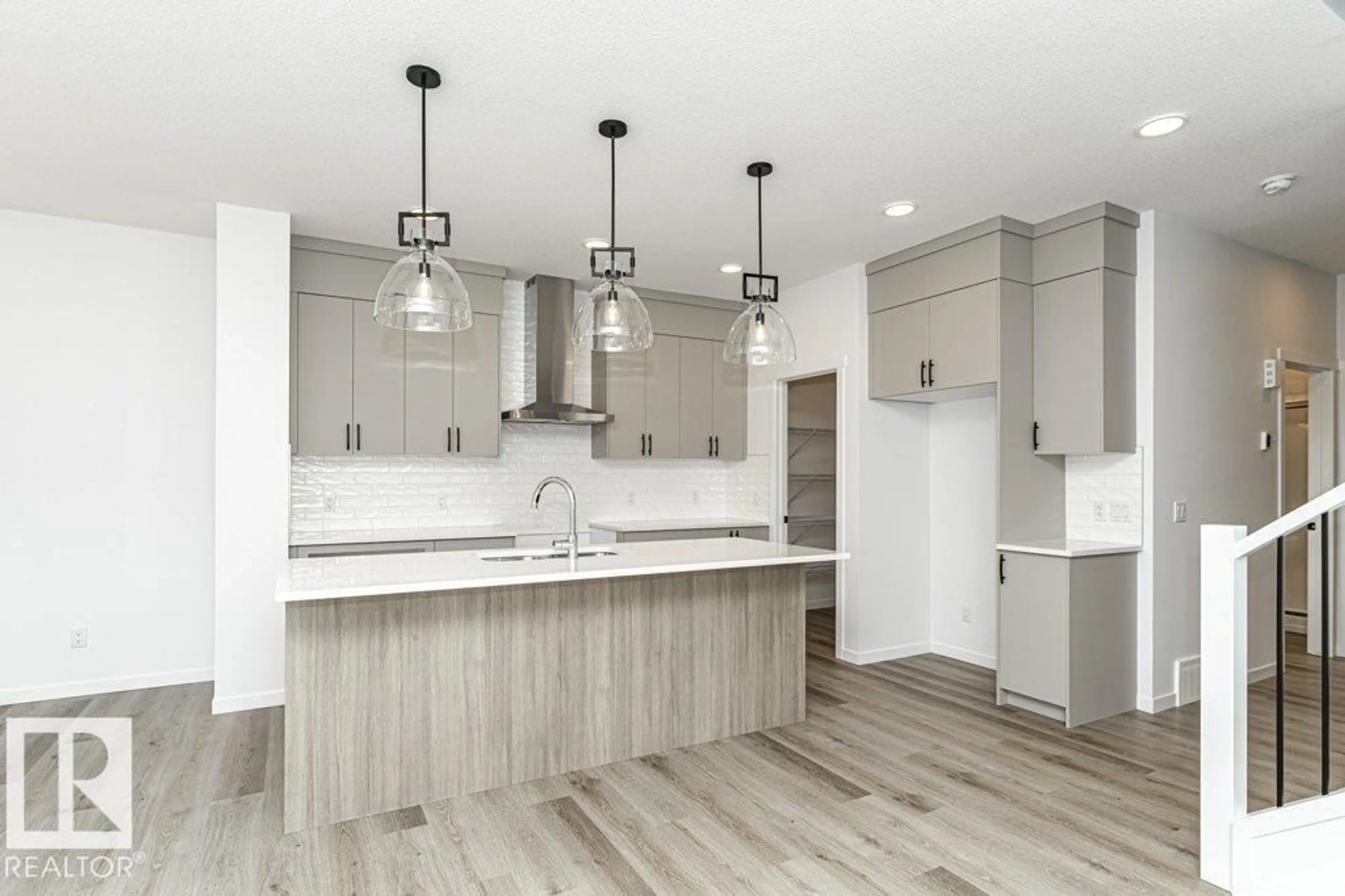 Open concept kitchen, wood/laminate floor for SW - 2524 158 ST, Edmonton Alberta T6W5P6