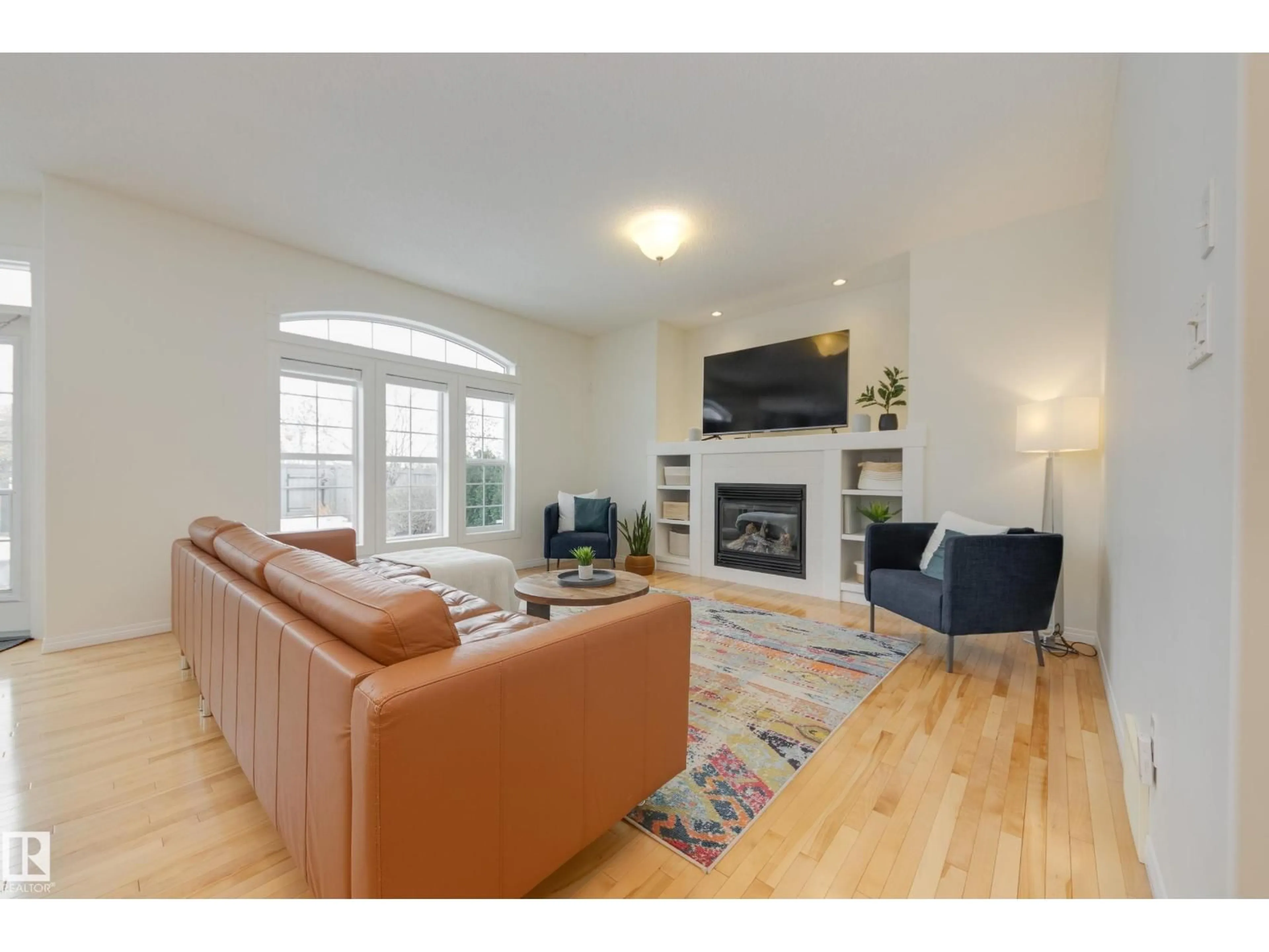 Living room with furniture, wood/laminate floor for 2532 BELL CO, Edmonton Alberta T6W1J9