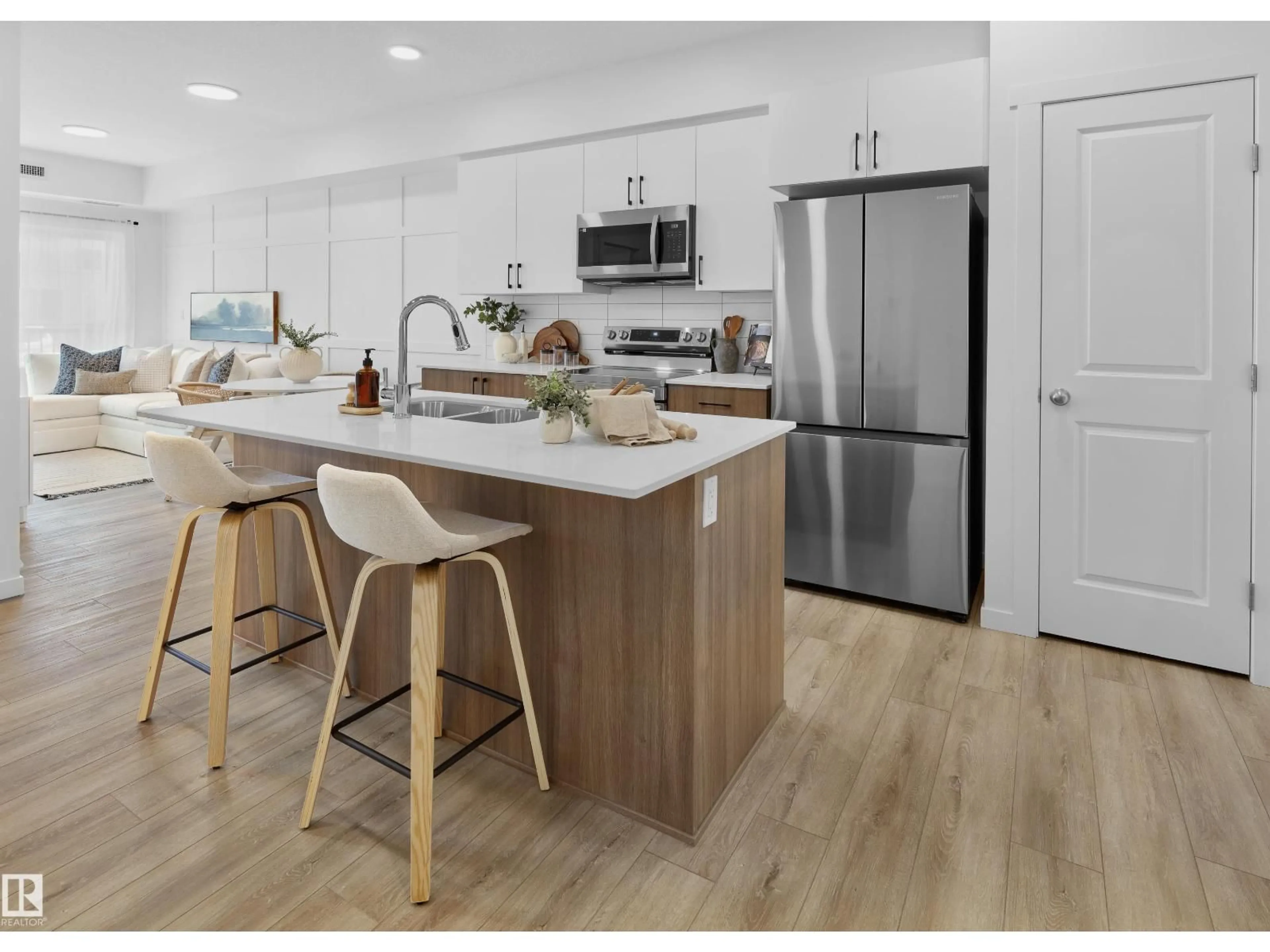 Open concept kitchen, wood/laminate floor for #101 - 9215 228 ST, Edmonton Alberta T5T7R9