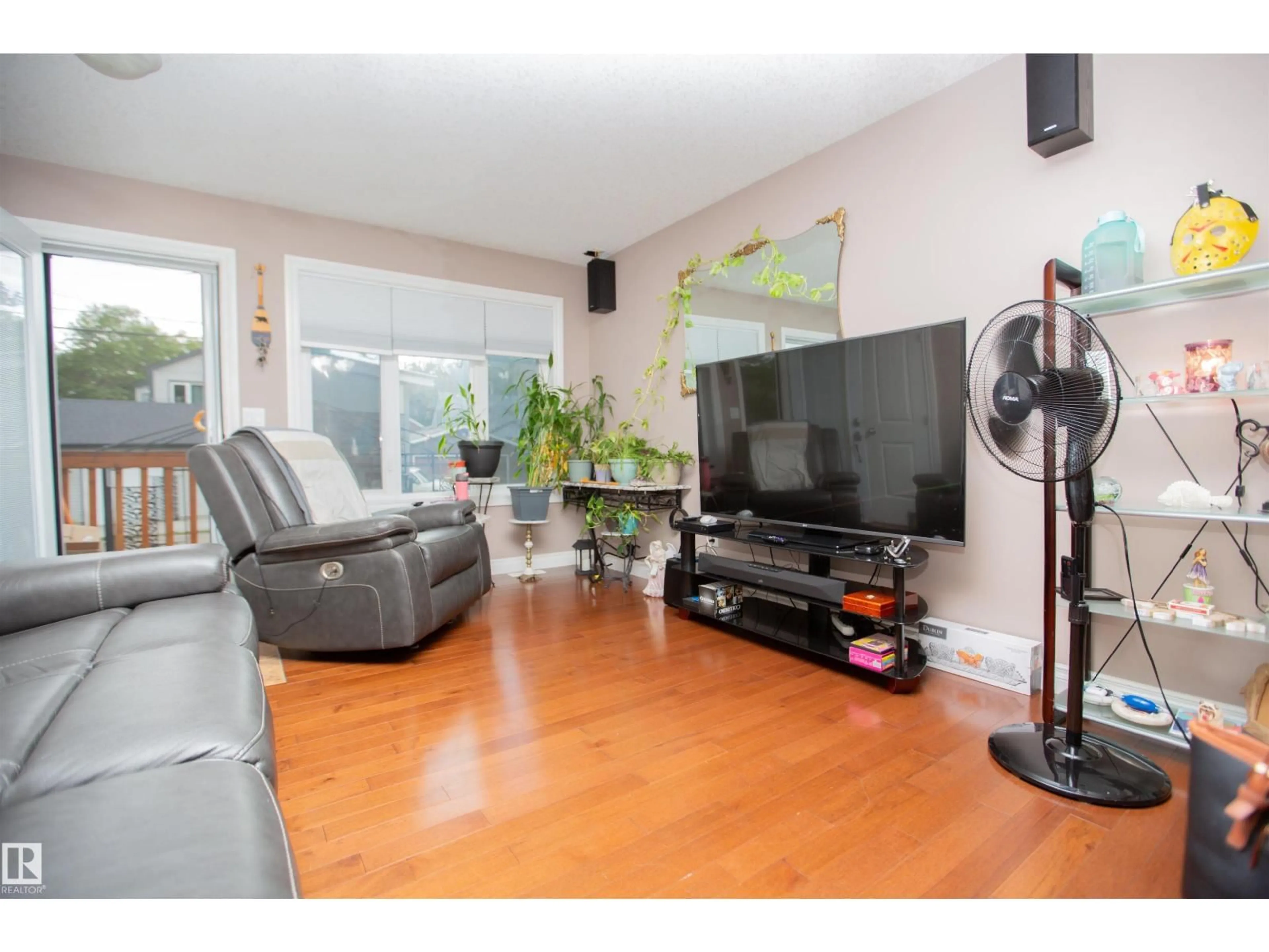 Living room with furniture, wood/laminate floor for 12026 91 ST, Edmonton Alberta T5B4B8