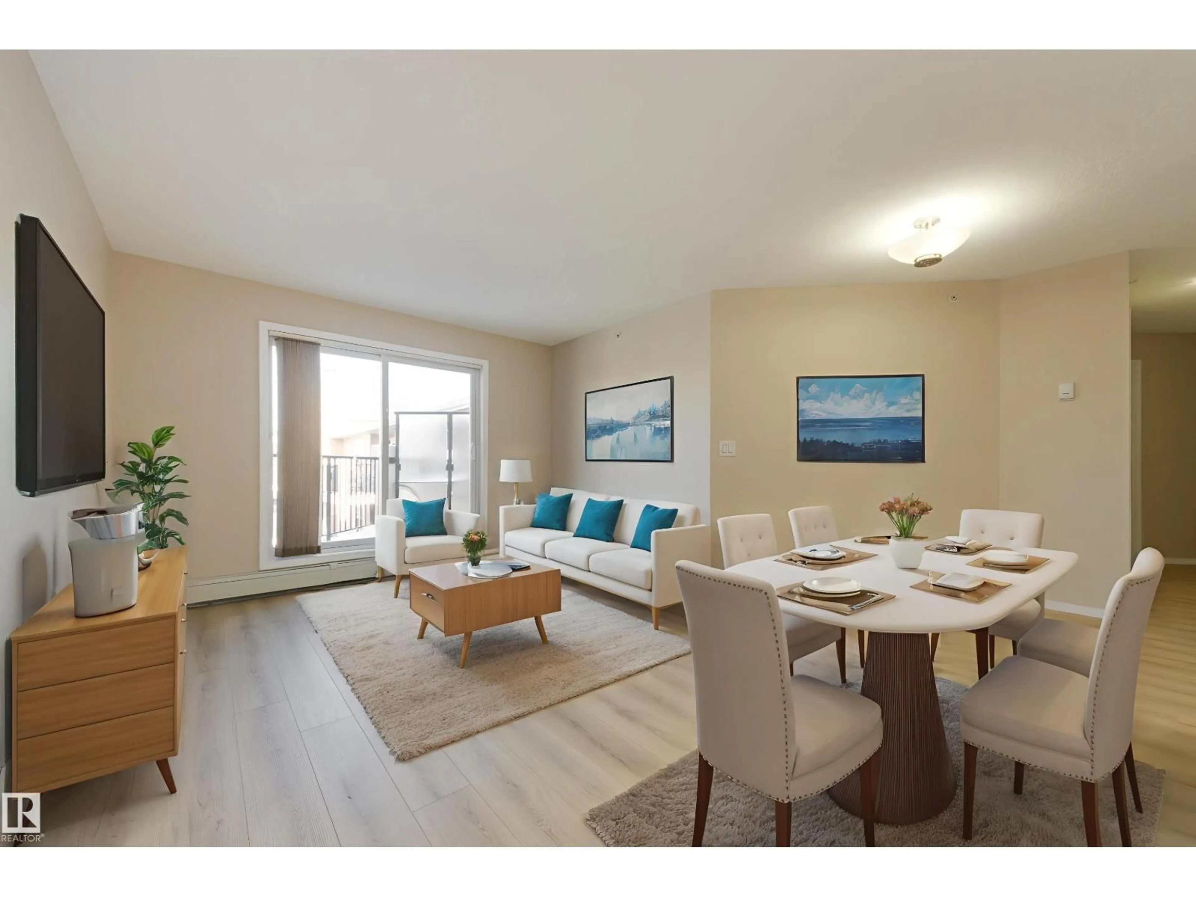 Living room with furniture, wood/laminate floor for #404 - 6070 SCHONSEE WY, Edmonton Alberta T5Z0G8